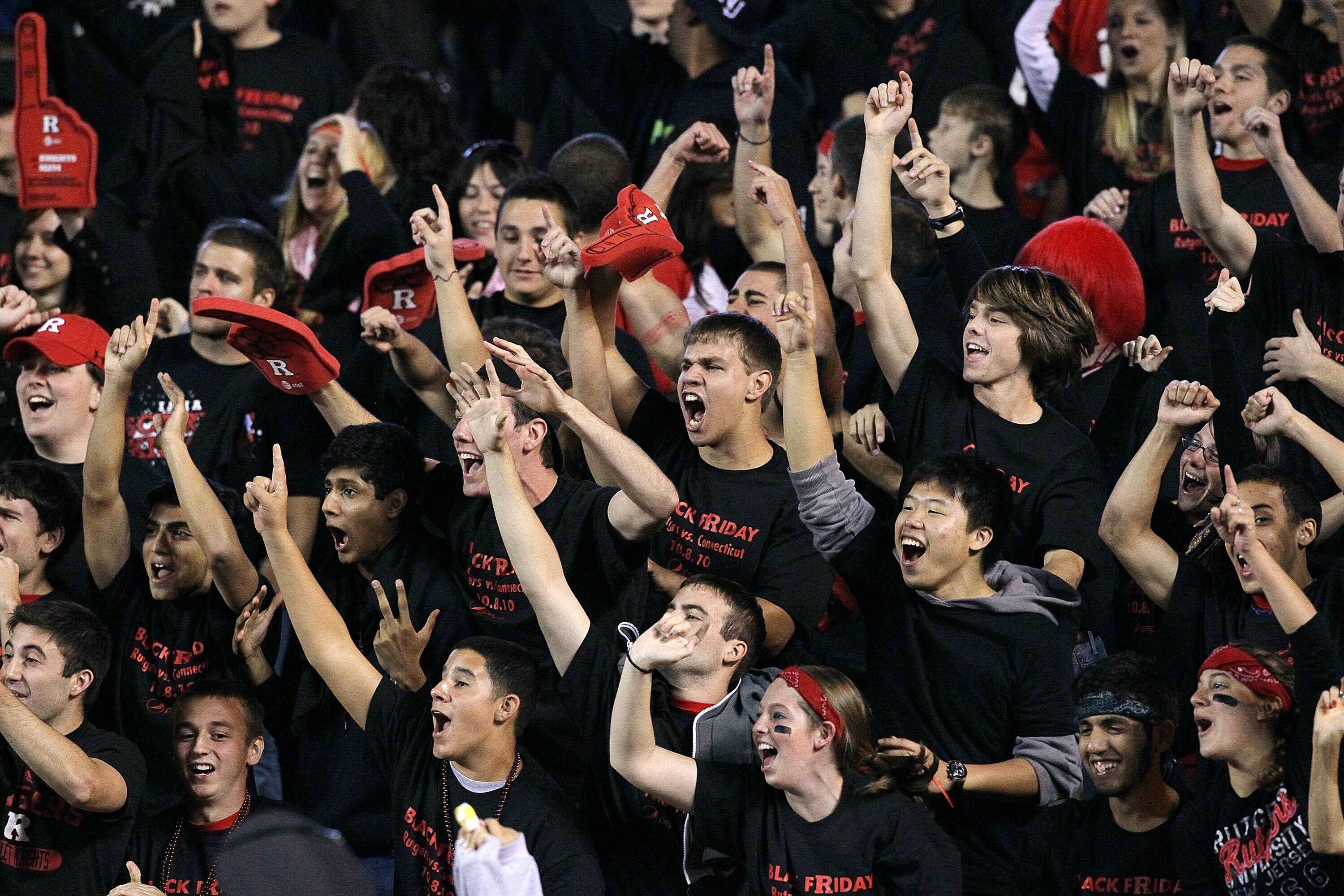 PISCATAWAY, NJ - OCTOBER 08: Rutgers Scarlet Knights fans cheer on their team as they play the Connecticut Huskies at Rutgers Stadium on October 8, 2010 in Piscataway, New Jersey. Rutgers defeated UConn 27-24. (Photo by Jim McIsaac/Getty Images) PISCATAWAY, NJ - OCTOBER 08: Rutgers Scarlet Knights fans cheer on their team as they play the Connecticut Huskies at Rutgers Stadium on October 8, 2010 in Piscataway, New Jersey. Rutgers defeated UConn 27-24. (Photo by Jim McIsaac/Getty Images)