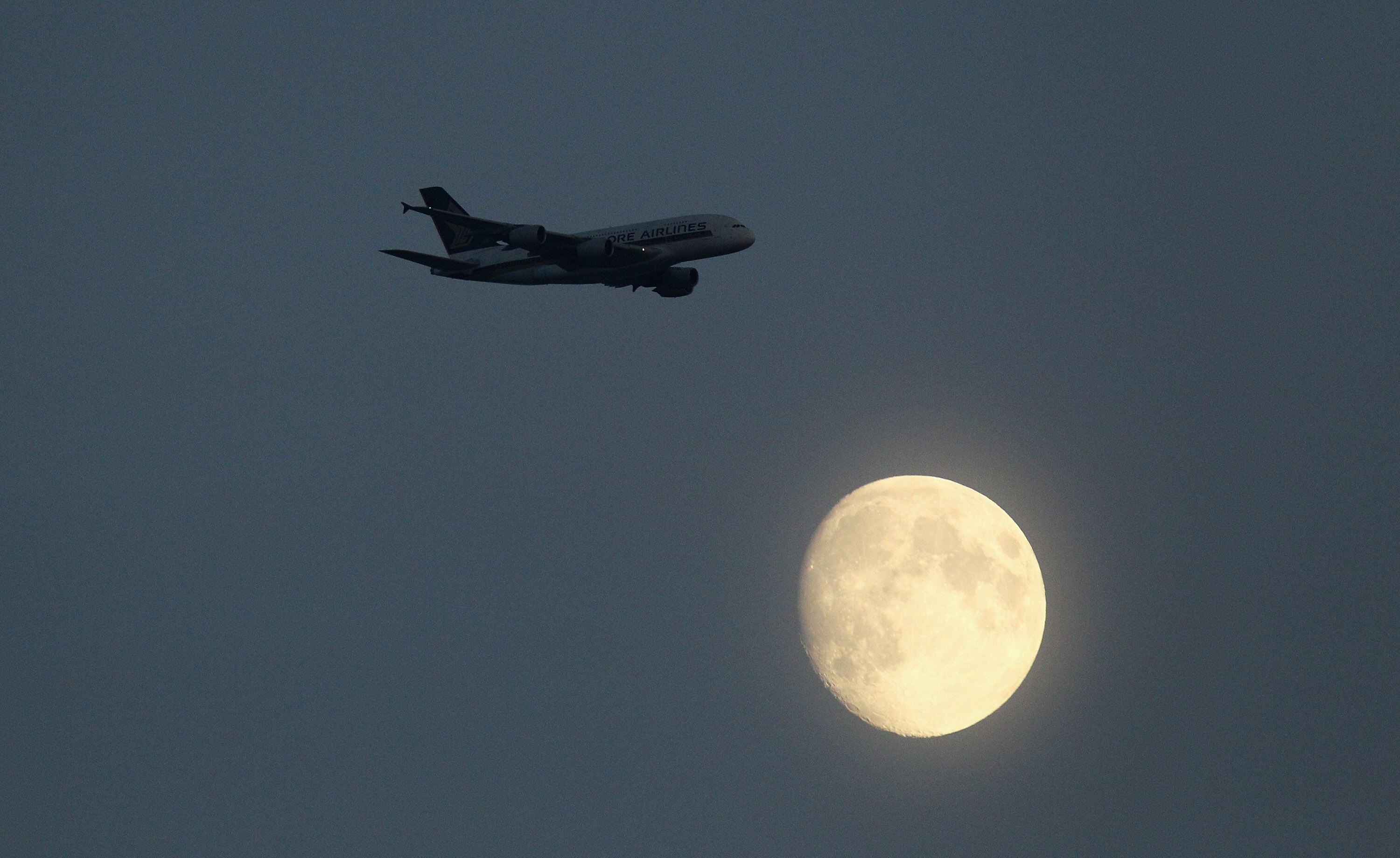 LONDON, ENGLAND - SEPTEMBER 20: A Singapore Airlines A380 aeroplane flies past the moon during the 4th NatWest One Day International between England and Pakistan at Lord's on September 20, 2010 in London, England. (Photo by Richard Heathcote/Getty Images LONDON, ENGLAND - SEPTEMBER 20: A Singapore Airlines A380 aeroplane flies past the moon during the 4th NatWest One Day International between England and Pakistan at Lord's on September 20, 2010 in London, England. (Photo by Richard Heathcote/Getty Images