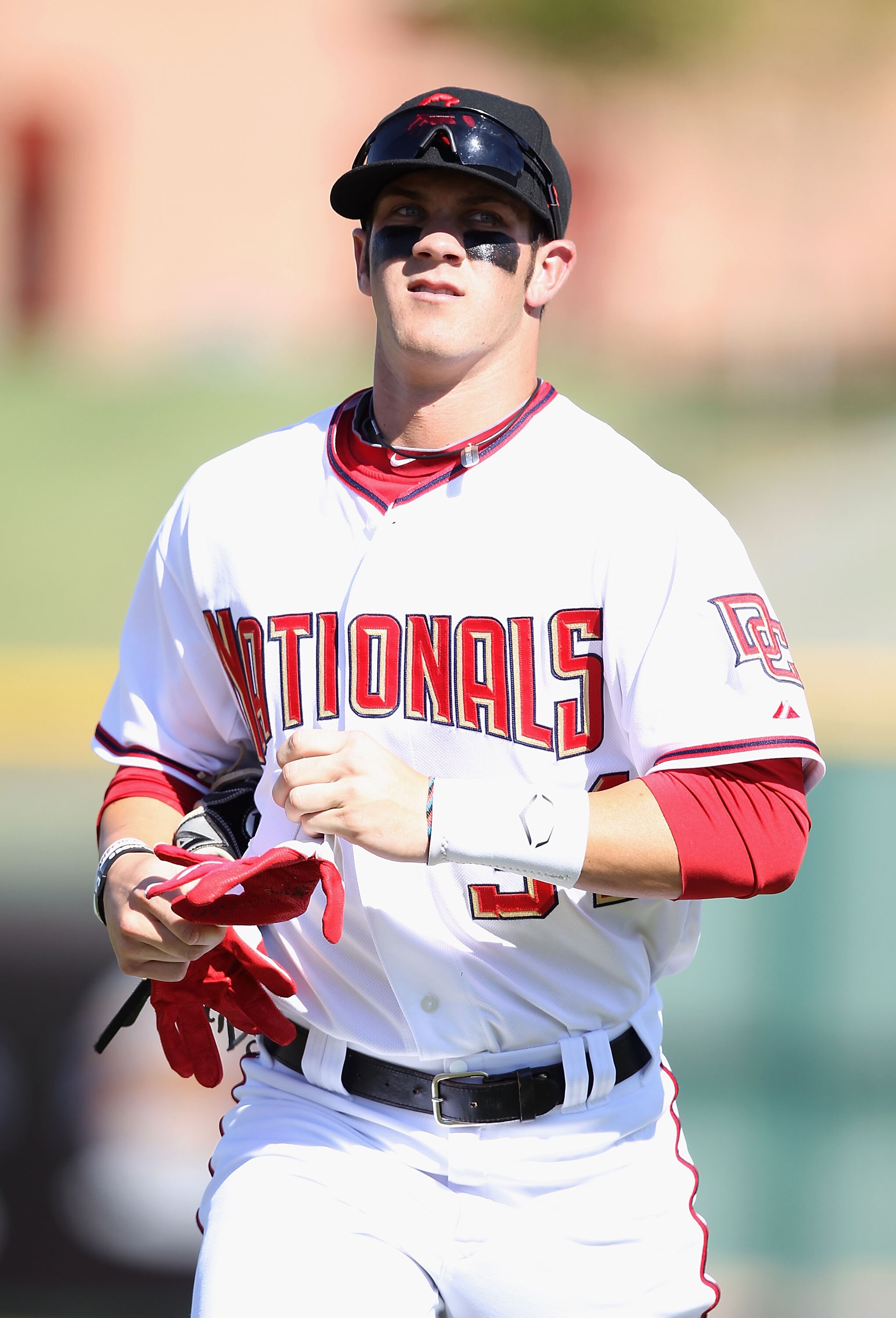 SCOTTSDALE, AZ - OCTOBER 23:  Washington Nationals prospect Bryce Harper #34 playing for the Scottsdale Scorpions runs in from the outfield during the AZ Fall League game against the Phoenix Desert Dogs at Scottsdale Stadium on October 23, 2010 in Scottsd