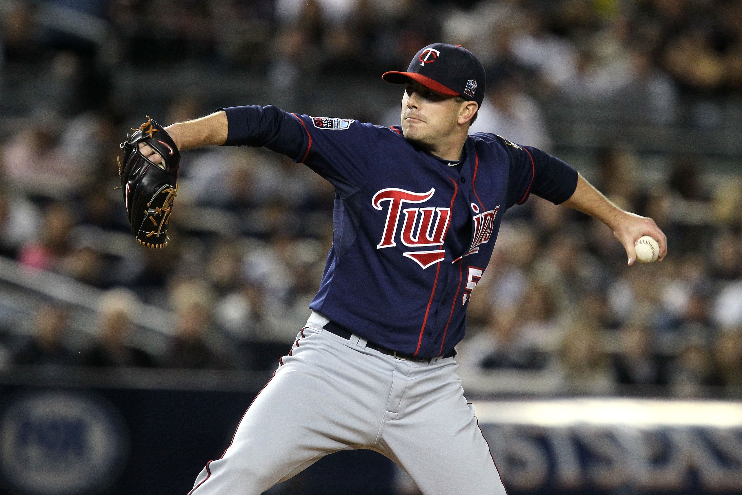 NEW YORK - OCTOBER 09: Starting pitcher Brian Duensing #52 of the Minnesota Twins throws a pitch against the New York Yankees during Game Three of the ALDS part of the 2010 MLB Playoffs at Yankee Stadium on October 9, 2010 in the Bronx borough of New Yor NEW YORK - OCTOBER 09: Starting pitcher Brian Duensing #52 of the Minnesota Twins throws a pitch against the New York Yankees during Game Three of the ALDS part of the 2010 MLB Playoffs at Yankee Stadium on October 9, 2010 in the Bronx borough of New Yor