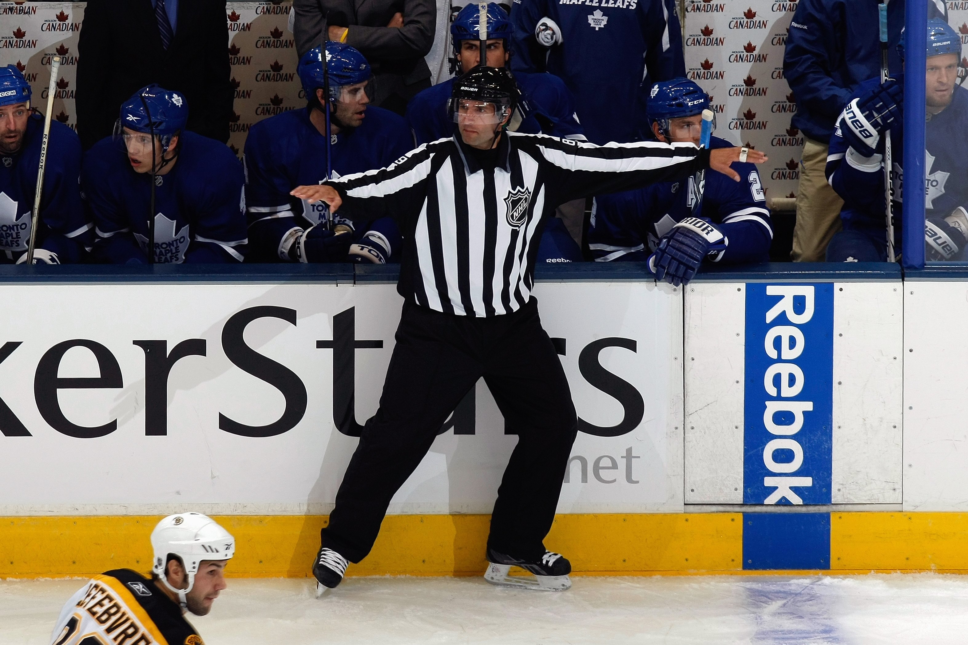 TORONTO - SEPTEMBER 16:  Steve Miller waves off an offside as the Toronto Maple Leafs play against the Boston Bruins during their NHL game at the Air Canada Centre on September 16, 2009 in Toronto, Ontario. (Photo by Dave Sandford/Getty Images)