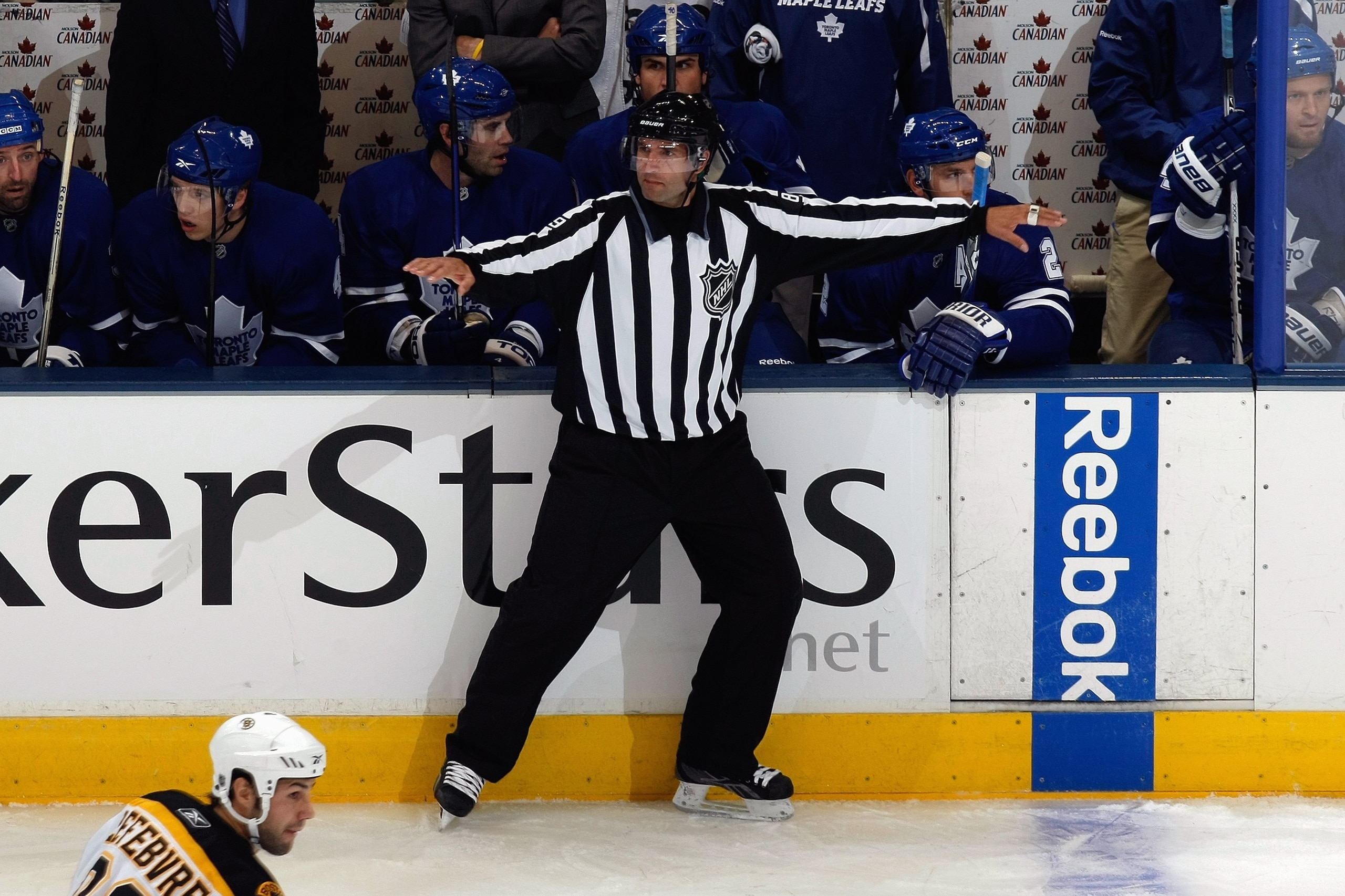 TORONTO - SEPTEMBER 16:  Steve Miller waves off an offside as the Toronto Maple Leafs play against the Boston Bruins during their NHL game at the Air Canada Centre on September 16, 2009 in Toronto, Ontario. (Photo by Dave Sandford/Getty Images)