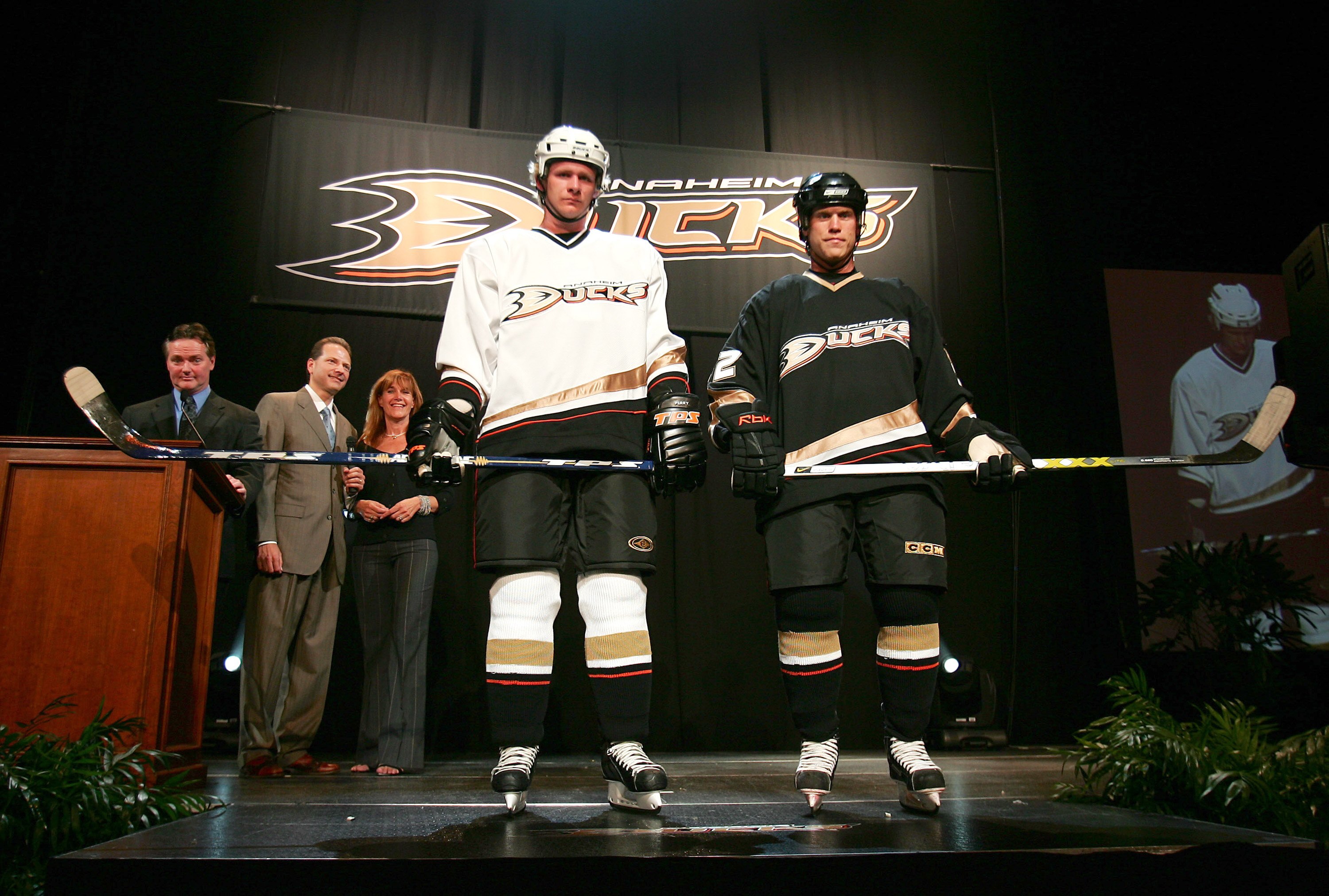 ANAHEIM, CA - JUNE 22: (L-R) Former NHL goaltender Bryan Hayward, Ducks Owners Henry Samuelis and Susan Samuelis look on as Anaheim Ducks players Corey Perry and Todd Marchant wear the new Anahaim Ducks uniforms at the Arrowhead Pond of Anaheim on June 22