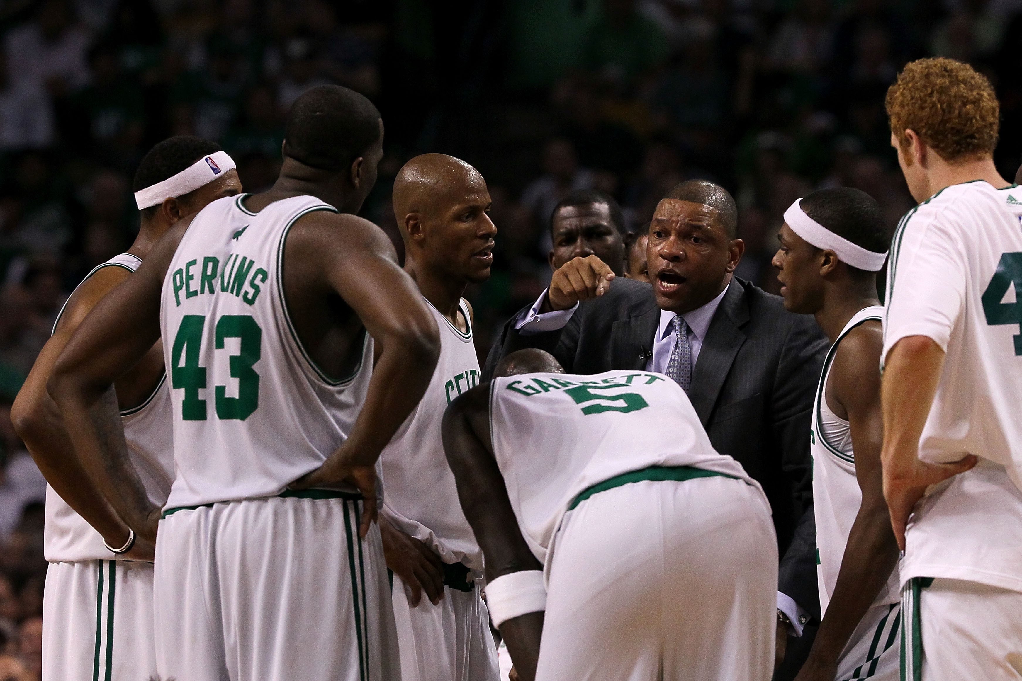 BOSTON - MAY 28:  Head coach Doc Rivers of the Boston Celtics talks with his players during a timeout against the Orlando Magic in Game Six of the Eastern Conference Finals during the 2010 NBA Playoffs at TD Garden on May 28, 2010 in Boston, Massachusetts