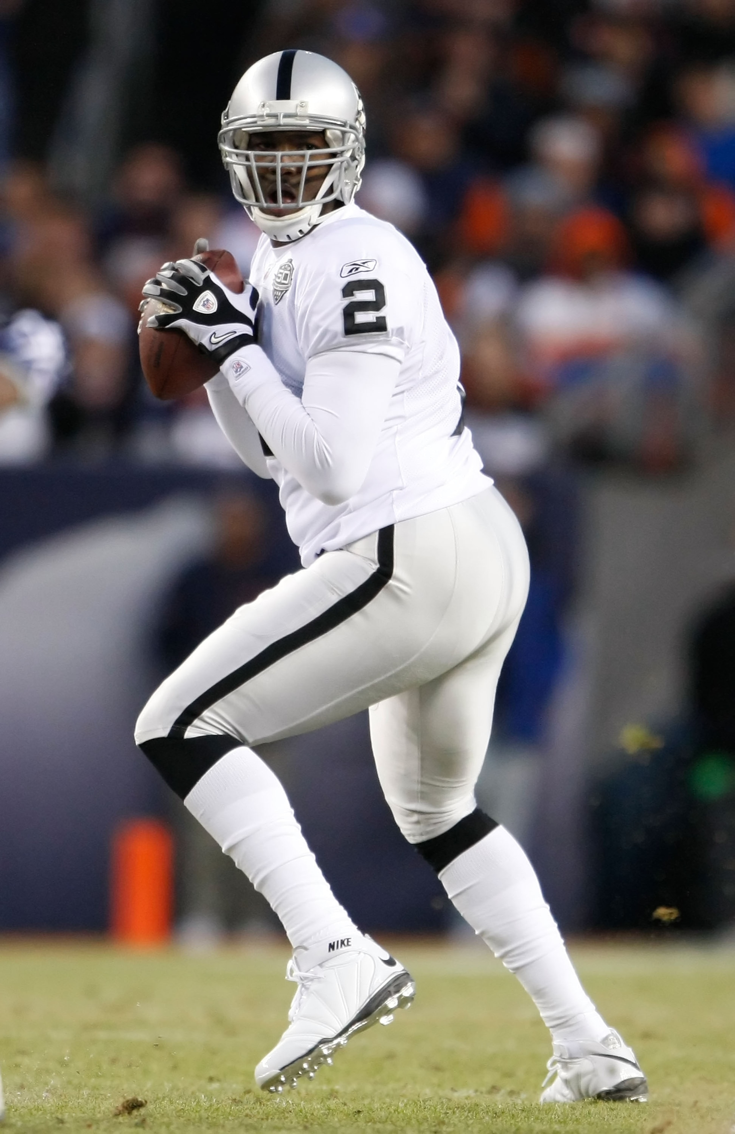 DENVER - DECEMBER 20:  Quarterback JaMarcus Russell #2 of the Oakland Raiders drops back to pass against the Denver Broncos in the fourth quarter at Invesco Field at Mile High on December 20, 2009 in Denver, Colorado. The Raiders defeated the Broncos 20-1
