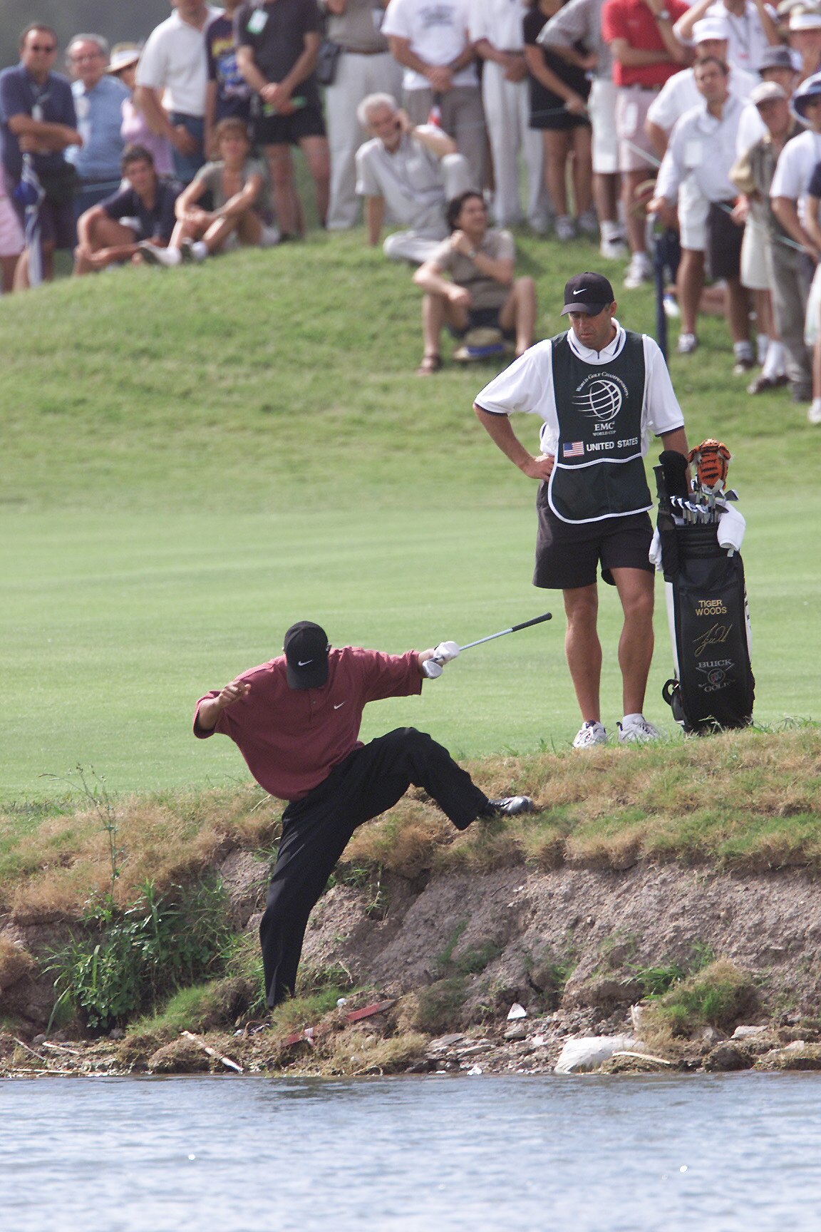 10 Dec 2000:  Tiger Woods steps down into a hazard to prepare to hit after partner David Duval's tee shot landed out of bounds on the ninth hole during the final round of the World Cup of Golf at the Buenos Aires Golf Club in Buenos Aires, Argentina.DIGIT