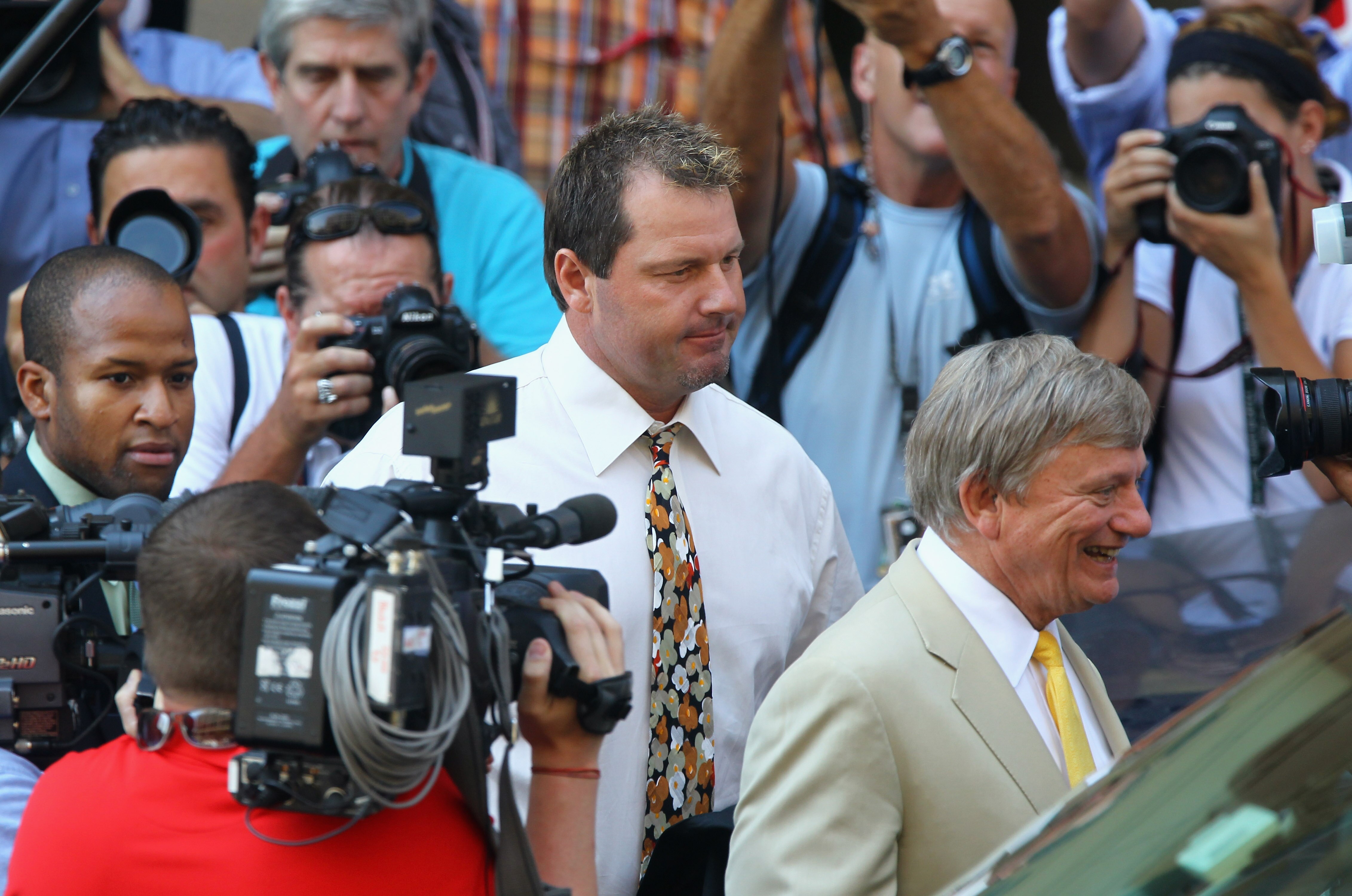 WASHINGTON - AUGUST 30:  Baseball pitching star Roger Clemens walks out of the U.S. District Court after his arraignment, on August 30, 2010 in Washington, DC. Seven-time Cy Young Award winner Clemens who plead not-guilty was charged with making false sta