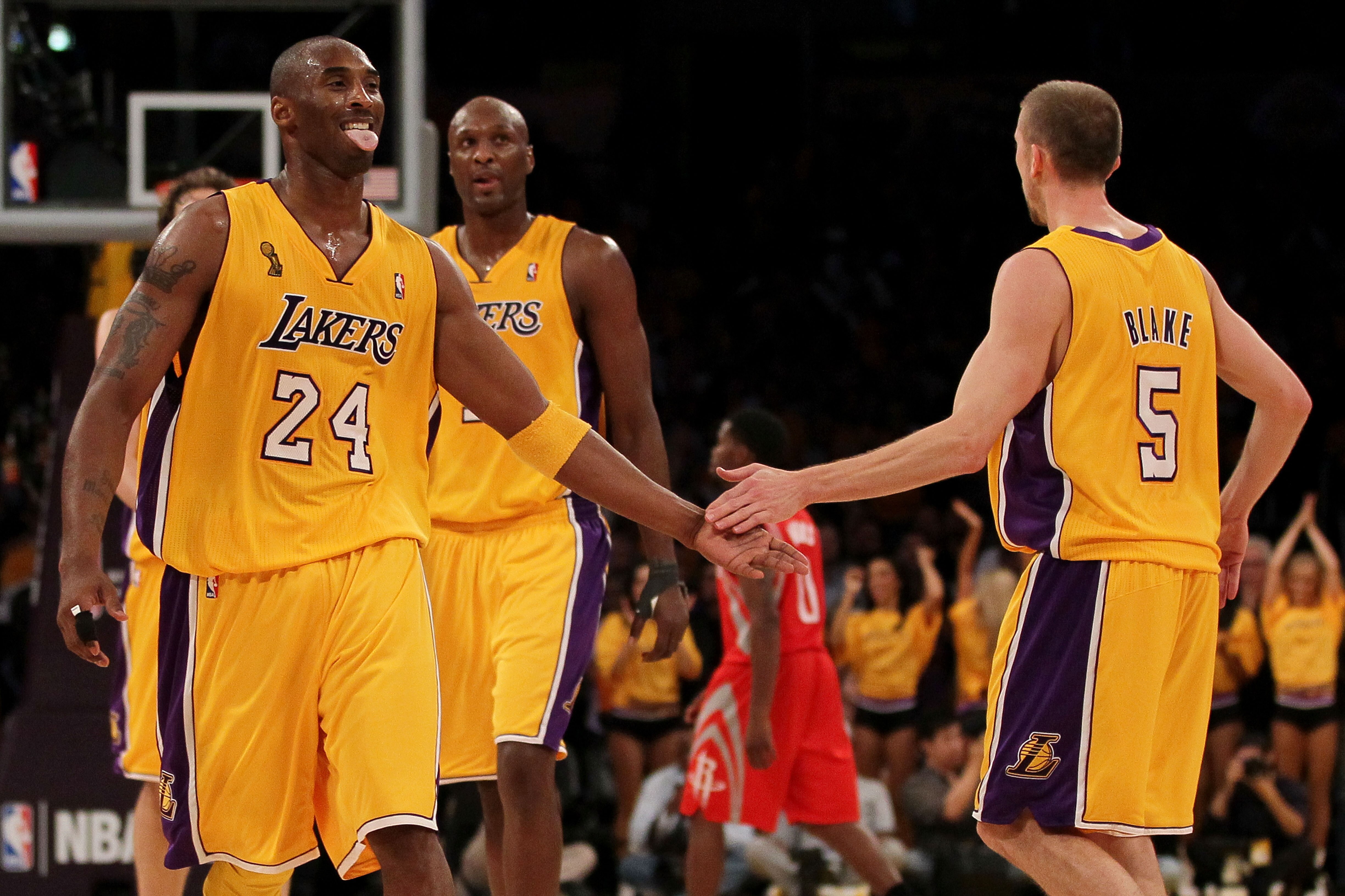 LOS ANGELES, CA - OCTOBER 26:  Kobe Bryant #24 of the Los Angeles Lakers and Steve Blake #5 celebrate scoring against the Houston Rockets during their opening night game at Staples Center on October 26, 2010 in Los Angeles, California. NOTE TO USER: User