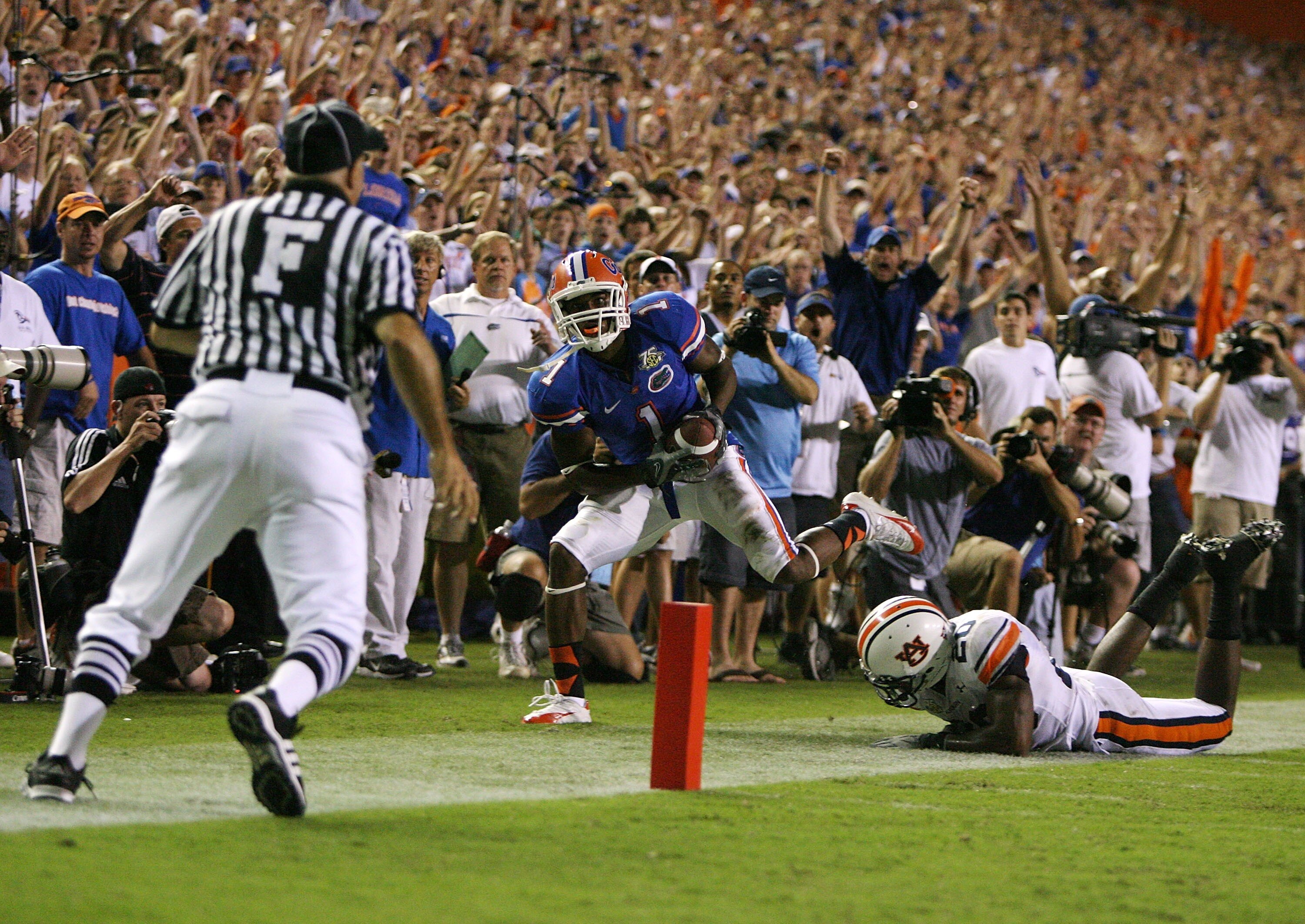 GAINESVILLE, FL - SEPTEMBER 29:  Wide receiver Percy Harvin #1 of the Florida Gators looks toward field judge Richard Morales as he steps out-of-bounds after making a catch that set up the game tying touchdown in the fourth quarter against Patrick Lee #20