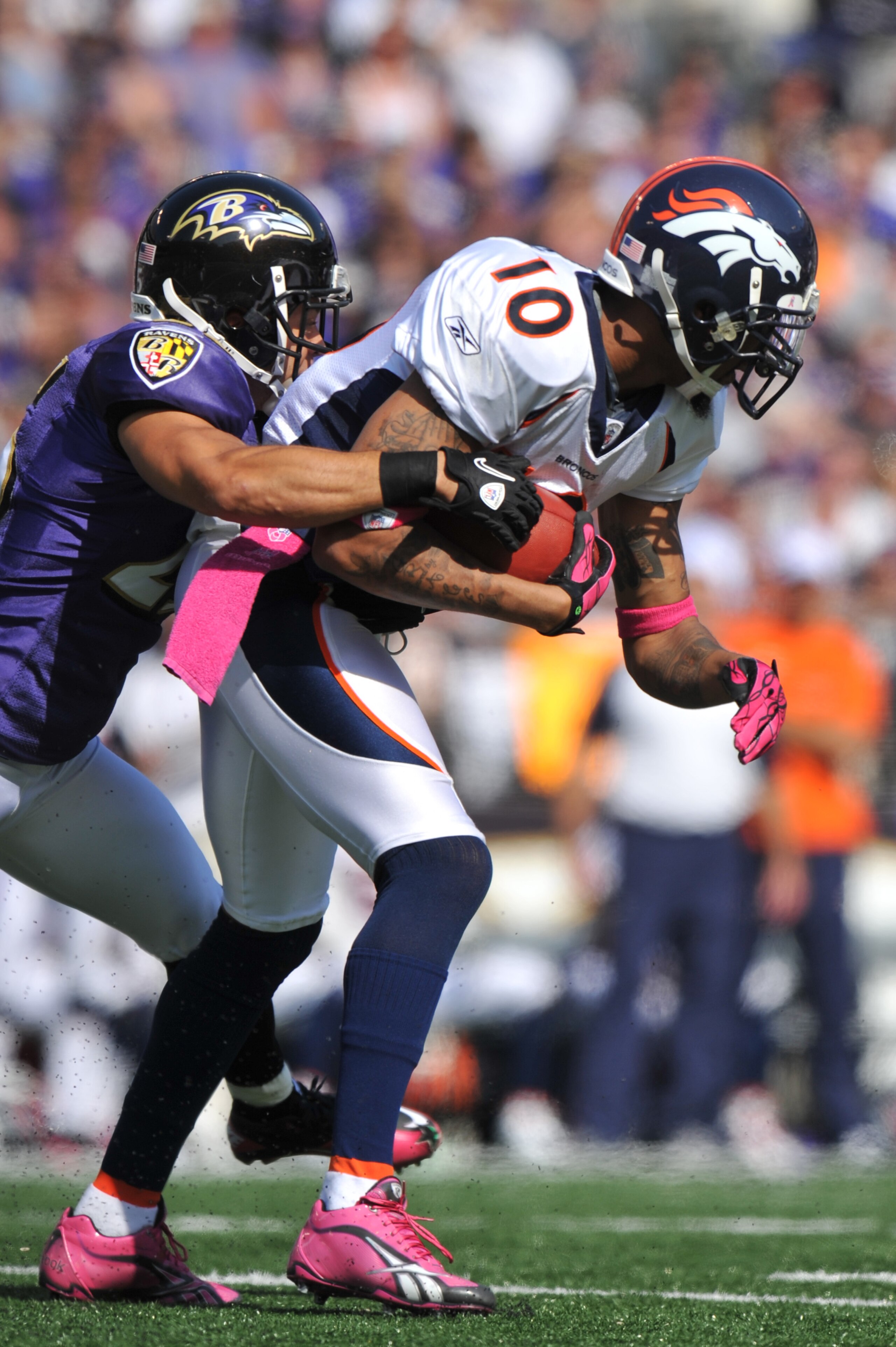 BALTIMORE, MD - OCTOBER 10: Jabar Gaffney #10 of the Denver Broncos runs the ball against the Baltimore Ravens at M&T Bank Stadium on October 10, 2010 in Baltimore, Maryland. Players wore pink in recognition of Breast Cancer Awareness Month. The Ravens d BALTIMORE, MD - OCTOBER 10: Jabar Gaffney #10 of the Denver Broncos runs the ball against the Baltimore Ravens at M&T Bank Stadium on October 10, 2010 in Baltimore, Maryland. Players wore pink in recognition of Breast Cancer Awareness Month. The Ravens d