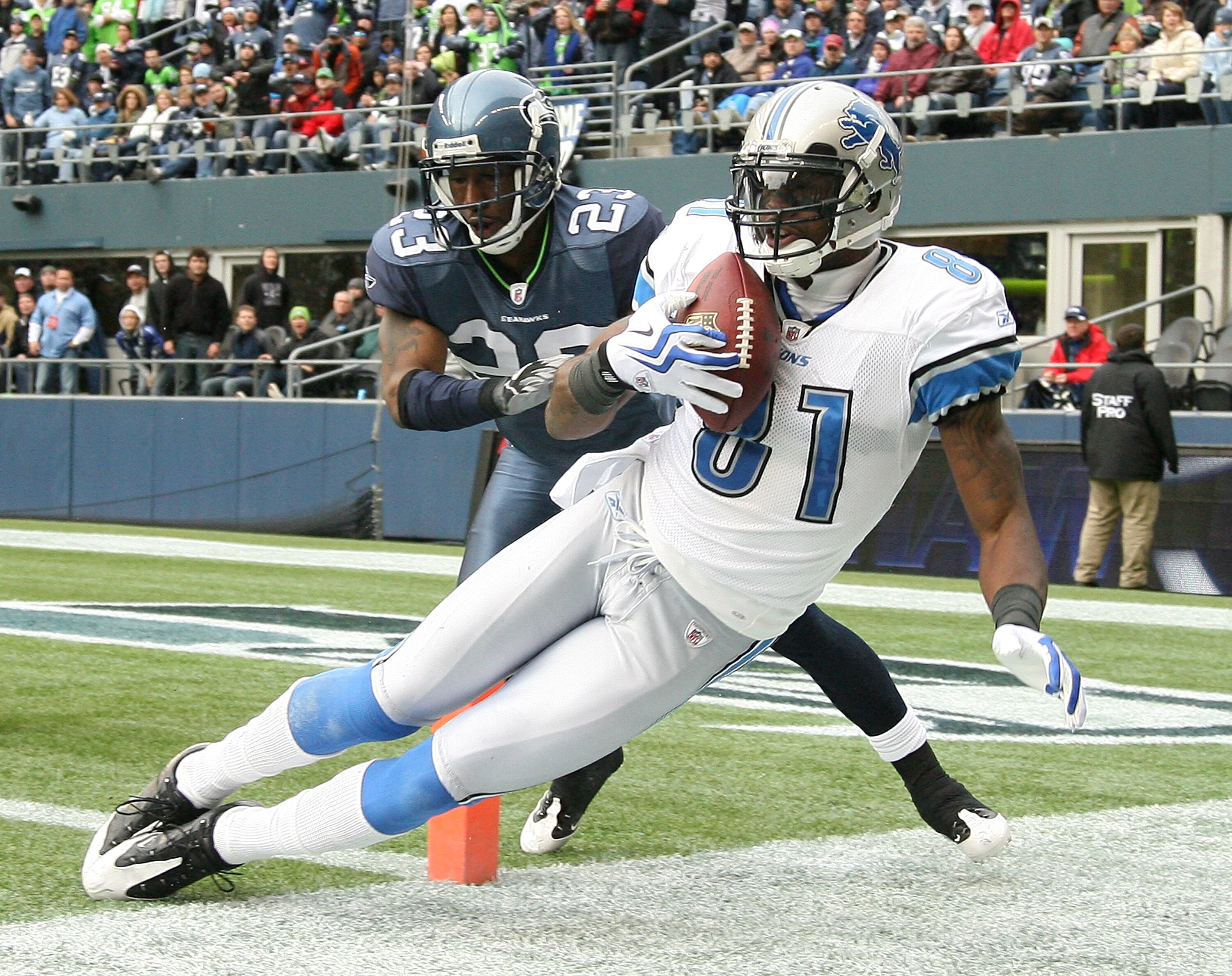 SEATTLE - NOVEMBER 08:  Wide receiver Calvin Johnson #81 of the Detroit Lions makes a catch at the one-yard line against Marcus Trufant #23 of the Seattle Seahawks on November 8, 2009 at Qwest Field in Seattle, Washington. Johnson was ruled out of bounds