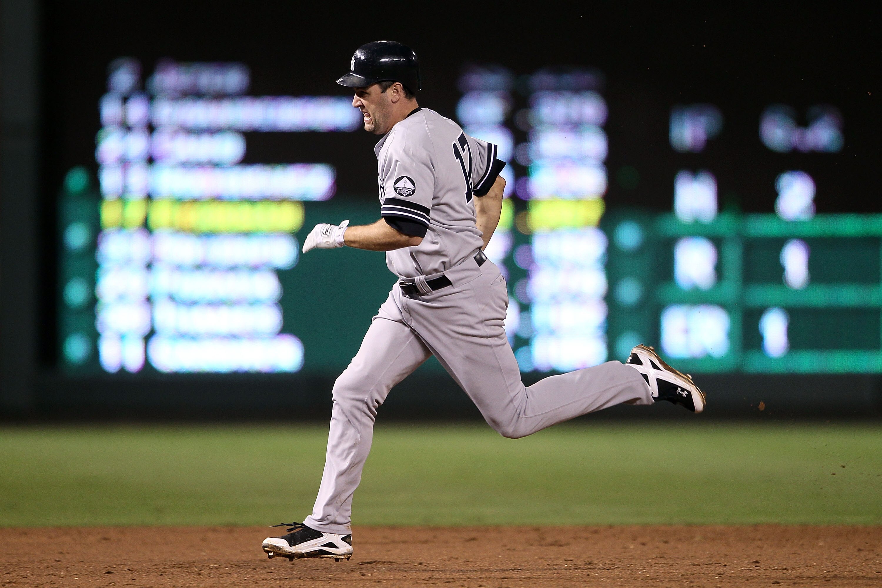 ARLINGTON, TX - OCTOBER 22:  Lance Berkman #17 of the New York Yankees runs towards third base on his triple in the top of the seventh inning against the Texas Rangers in Game Six of the ALCS during the 2010 MLB Playoffs at Rangers Ballpark in Arlington o