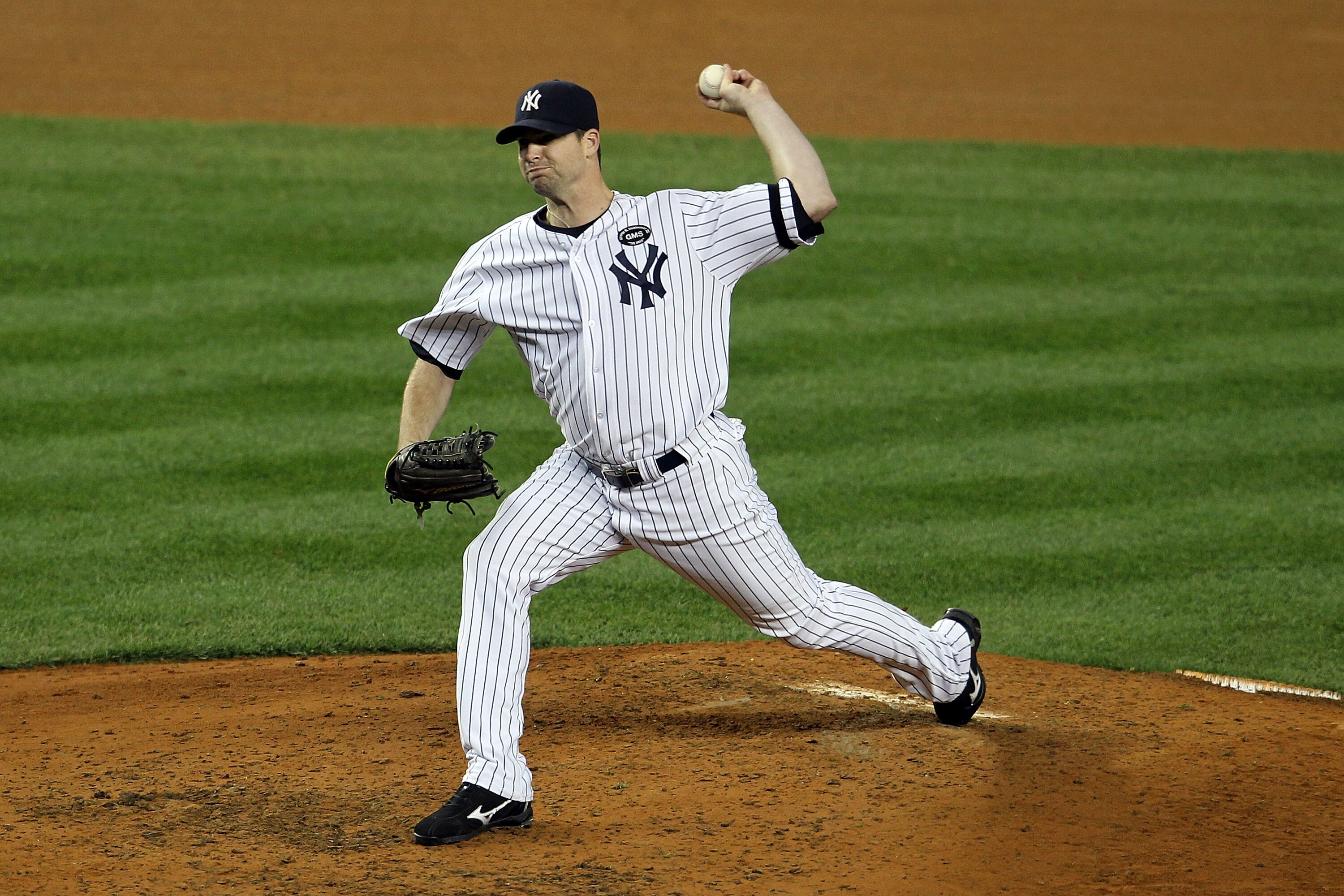 NEW YORK - OCTOBER 19:  Boone Logan #48 of the New York Yankees pitches against the Texas Rangers in Game Four of the ALCS during the 2010 MLB Playoffs at Yankee Stadium on October 19, 2010 in the Bronx borough of New York City.  (Photo by Nick Laham/Gett