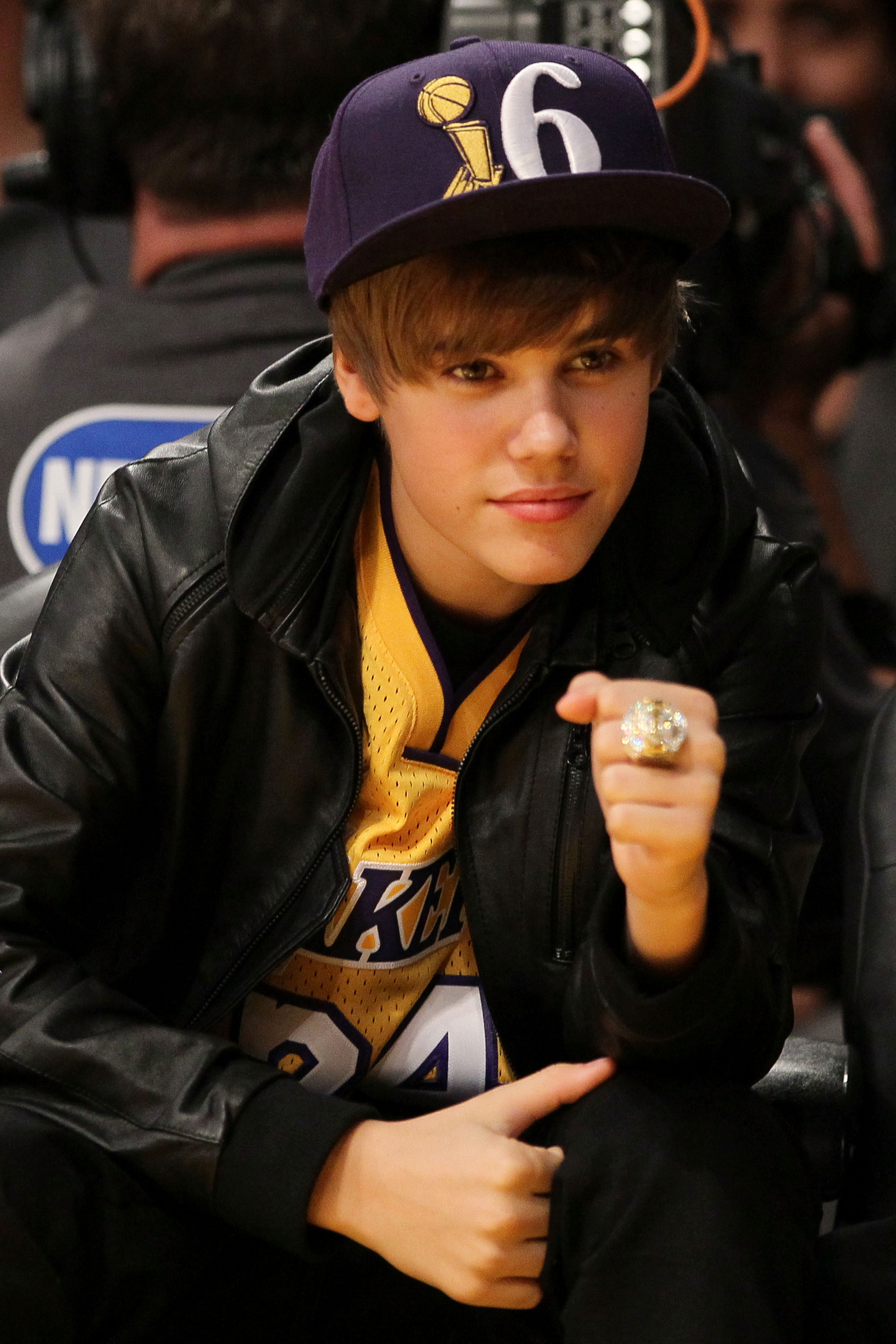 LOS ANGELES, CA - OCTOBER 26:  Singer Justin Bieber wears the championship ring of head coach Phil Jackson of the Los Angeles Lakers as the Lakers play the Houston Rockets during their opening night game at Staples Center on October 26, 2010 in Los Angele