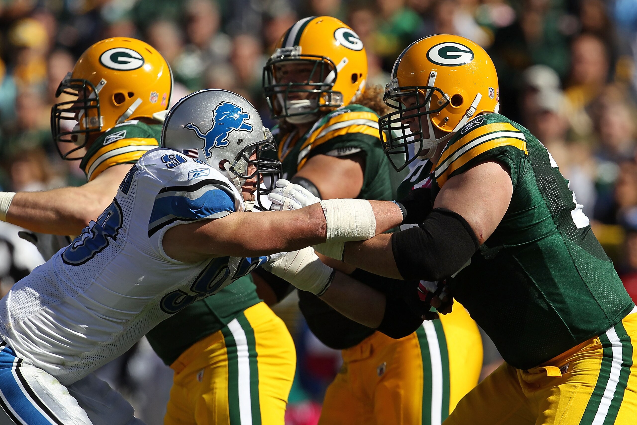 GREEN BAY, WI - OCTOBER 03: Chad Clifton #76 of the Green Bay Packers blocks Kyle Vanden Bosch #93 of the Detroit Lions at Lambeau Field on October 3, 2010 in Green Bay, Wisconsin. The Packers defeated the Lions 28-26. (Photo by Jonathan Daniel/Getty Imag