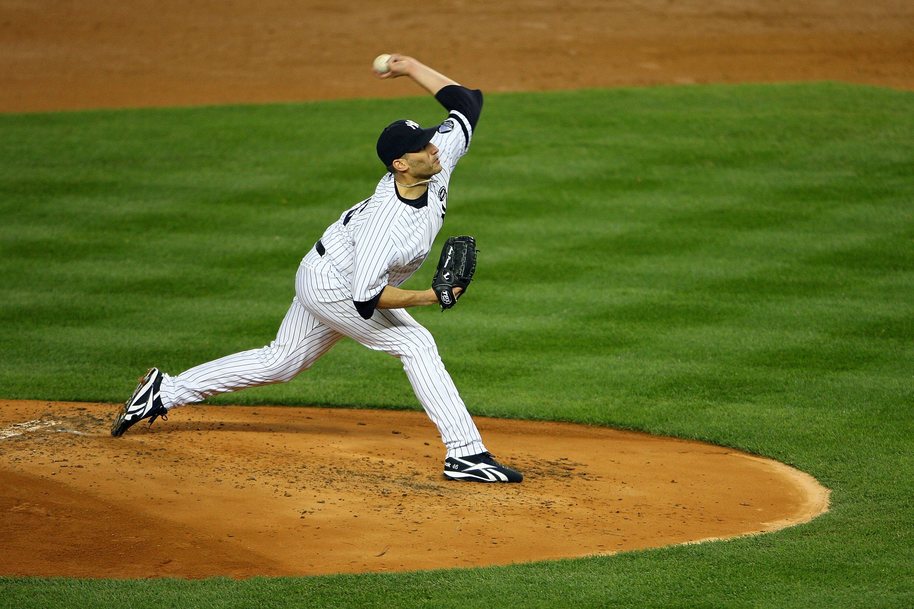 NEW YORK - OCTOBER 18:  Andy Pettitte #46 of the New York Yankees pitches against the Texas Rangers in Game Three of the ALCS during the 2010 MLB Playoffs at Yankee Stadium on October 18, 2010 in New York, New York.  (Photo by Andrew Burton/Getty Images)