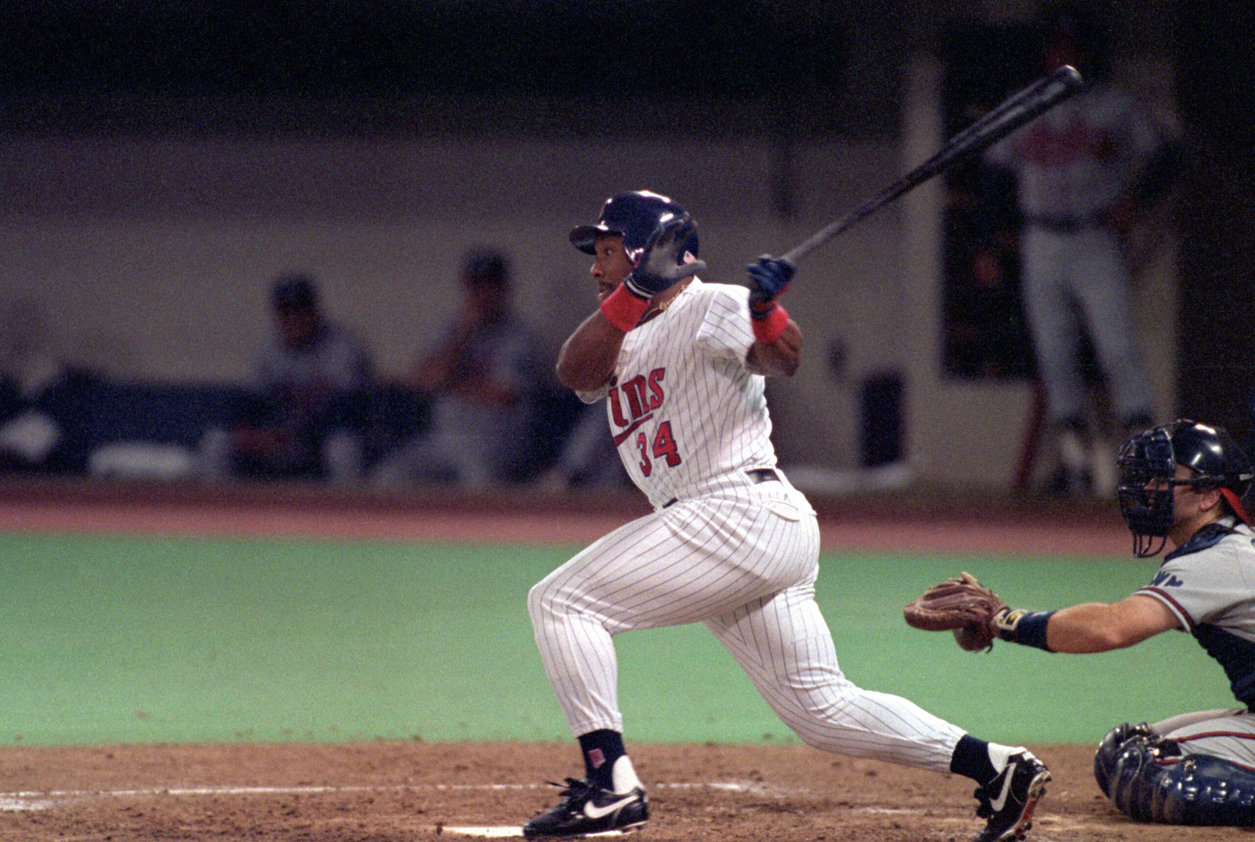 MINNEAPOLIS - OCTOBER 20:  Kirby Puckett #34 of the Minnesota Twins swings at a pitch during Game two of the 1991 World Series against the Atlanta Braves at the Metrodome on October 20, 1991 in Minneapolis, Minnesota. The Twins defeated the Braves 3-2.  (