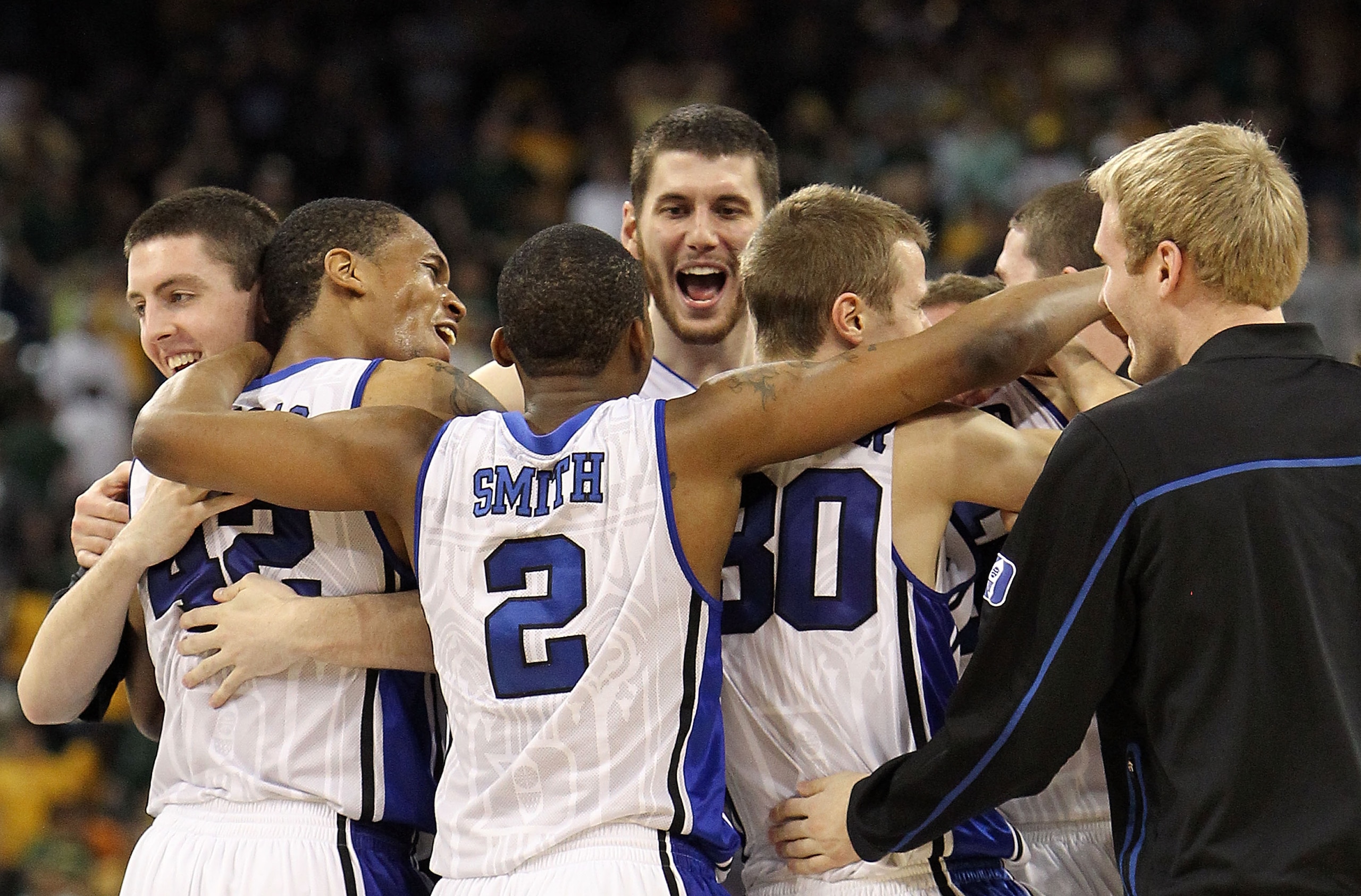 HOUSTON - MARCH 28: (L-R) Ryan Kelly #42, Lance Thomas #42 Nolan Smith #2, Brian Zoubek #55 and Jon Scheyer #30 of the Duke Blue Devils celebrate a win against the Baylor Bears during the south regional final of the 2010 NCAA men's basketball tournament a