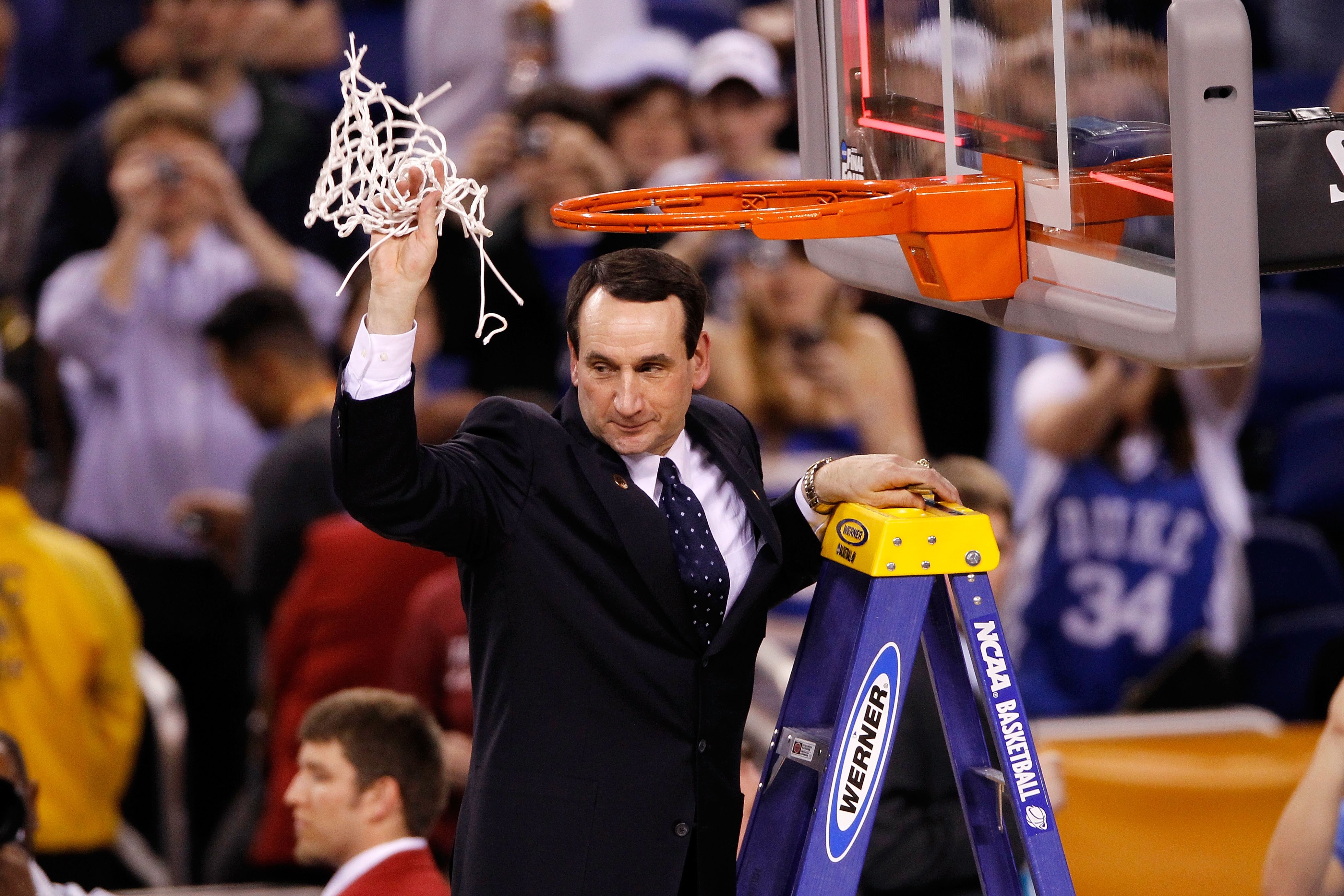 INDIANAPOLIS - APRIL 05:  Head coach Mike Krzyzewski of the Duke Blue Devils celebrates after he cut down a piece of the net following their 61-59 win against the Butler Bulldogs during the 2010 NCAA Division I Men's Basketball National Championship game