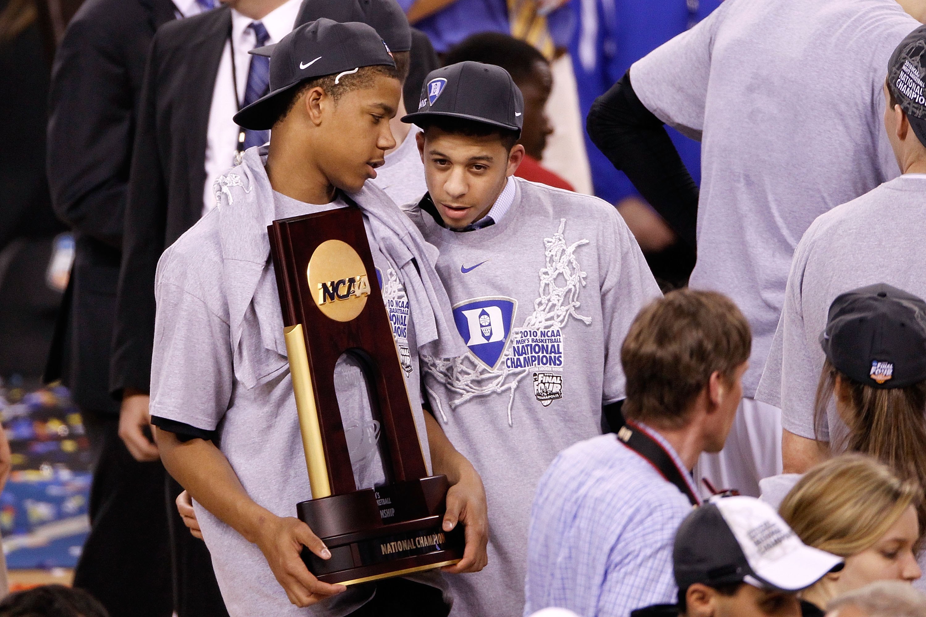 INDIANAPOLIS - APRIL 05:  (L-R) Andre Dawkins and Seth Curry of the Duke Blue Devils celebrate with the trophy after Duke won 61-59 against the Butler Bulldogs during the 2010 NCAA Division I Men's Basketball National Championship game at Lucas Oil Stadiu