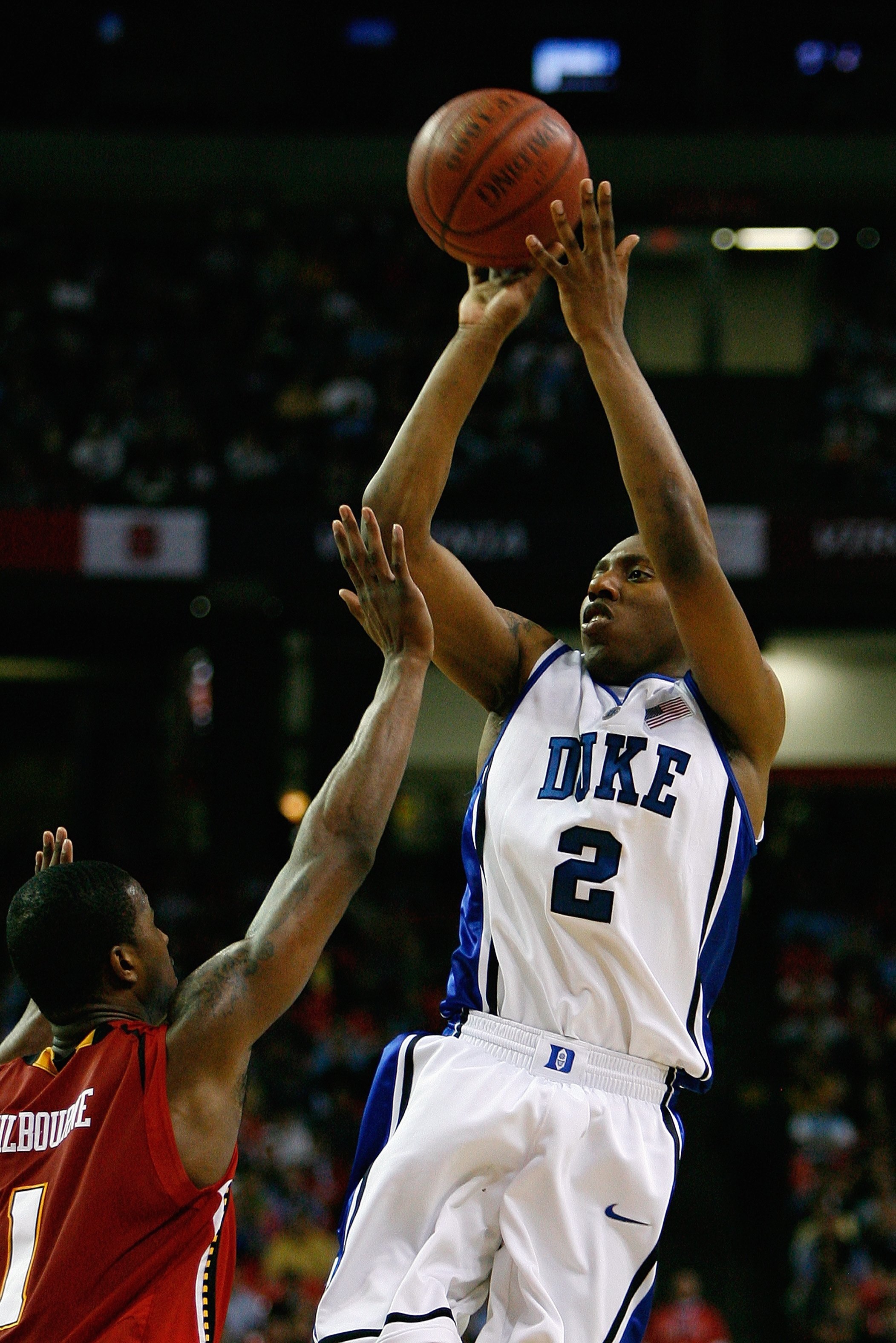 ATLANTA - MARCH 14:  Nolan Smith #2 of the Duke Blue Devils shoots a jump shot against Landon Milbourne #1 of the Maryland Terrapins during the semifinals of the 2009 ACC Men's Basketball Tournament on March 14, 2009 at the Georgia Dome in Atlanta, Georgi