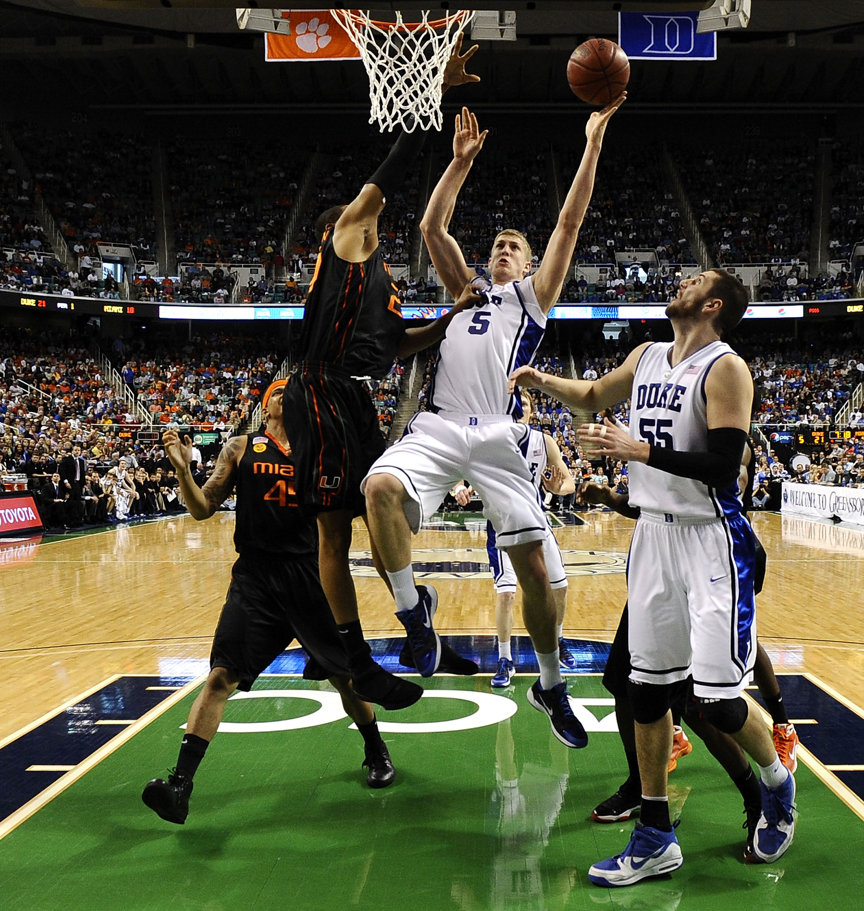 GREENSBORO, NC - MARCH 13:  Mason Plumlee #5 of the Duke Blue Devils shoots against of the University of Miami Hurricanes in their semifinal game in the 2010 ACC Men's Basketball Tournament at the Greensboro Coliseum on on March 13, 2010 in Greensboro, No