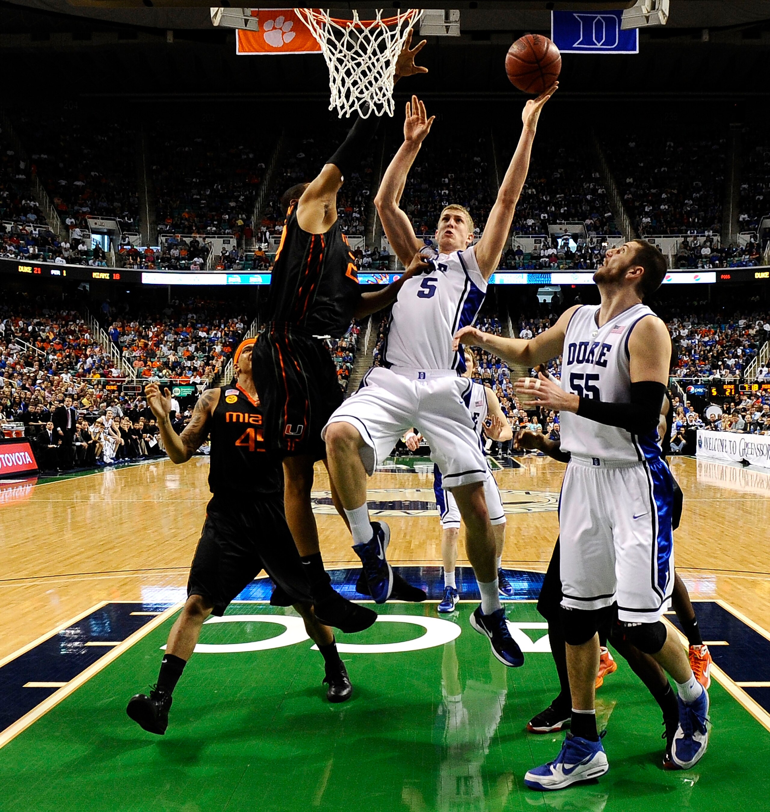 GREENSBORO, NC - MARCH 13:  Mason Plumlee #5 of the Duke Blue Devils shoots against of the University of Miami Hurricanes in their semifinal game in the 2010 ACC Men's Basketball Tournament at the Greensboro Coliseum on on March 13, 2010 in Greensboro, No