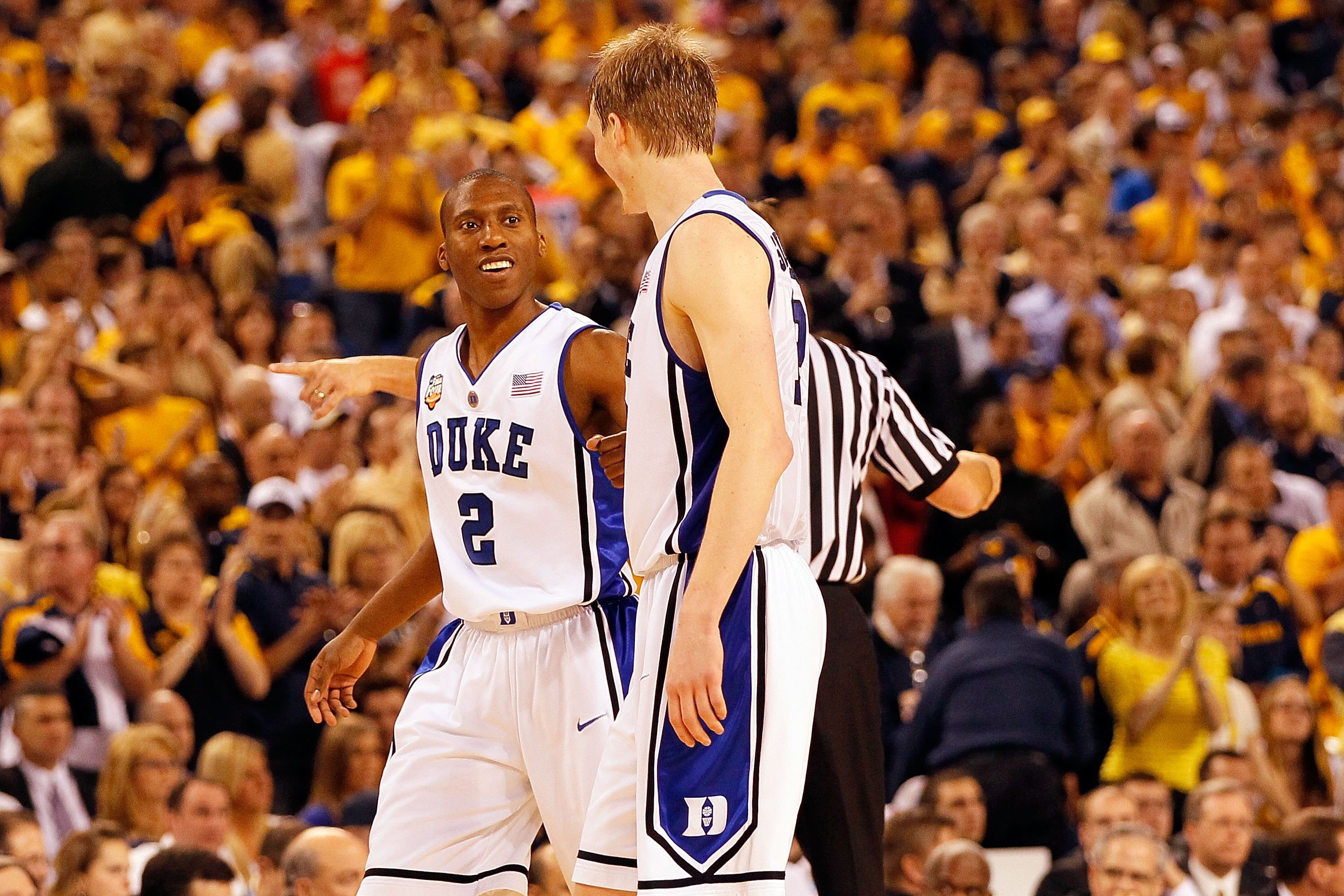 INDIANAPOLIS - APRIL 03:  Nolan Smith #2 of the Duke Blue Devils reacts with teammate Kyle Singler #12 before the Blue Devils defeated the West Virginia Mountaineers 78-57 during the National Semifinal game of the 2010 NCAA Division I Men's Basketball Cha
