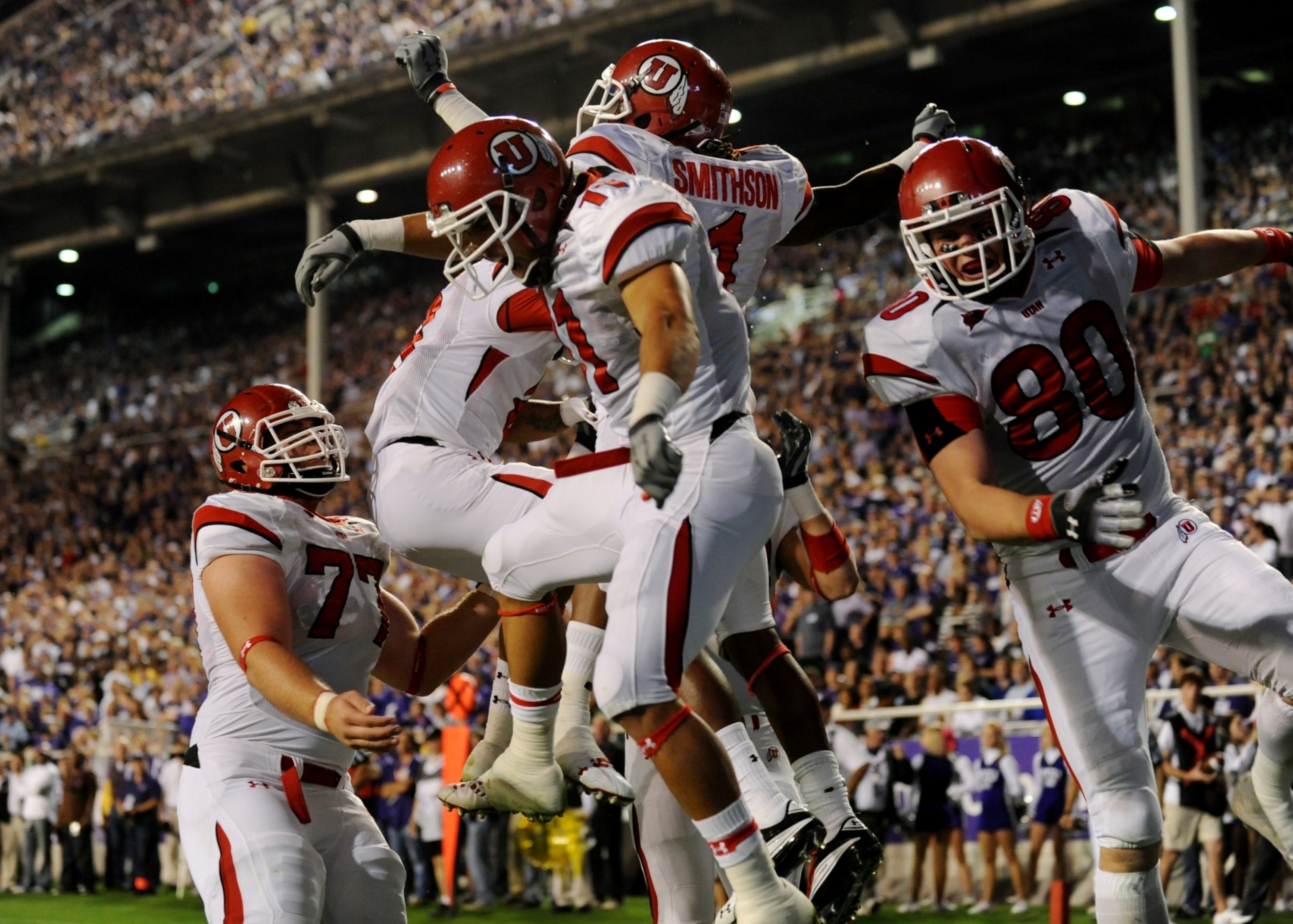 FORT WORTH, TX - NOVEMBER 14:  Shaky Smithson #1 of the Utah Utes celebrates with teammates after scoring a touchdown in the first quarter of the game against the TCU Horned Frogs at Amon G. Carter Stadium on November 14, 2009 in Fort Worth, Texas.  (Phot