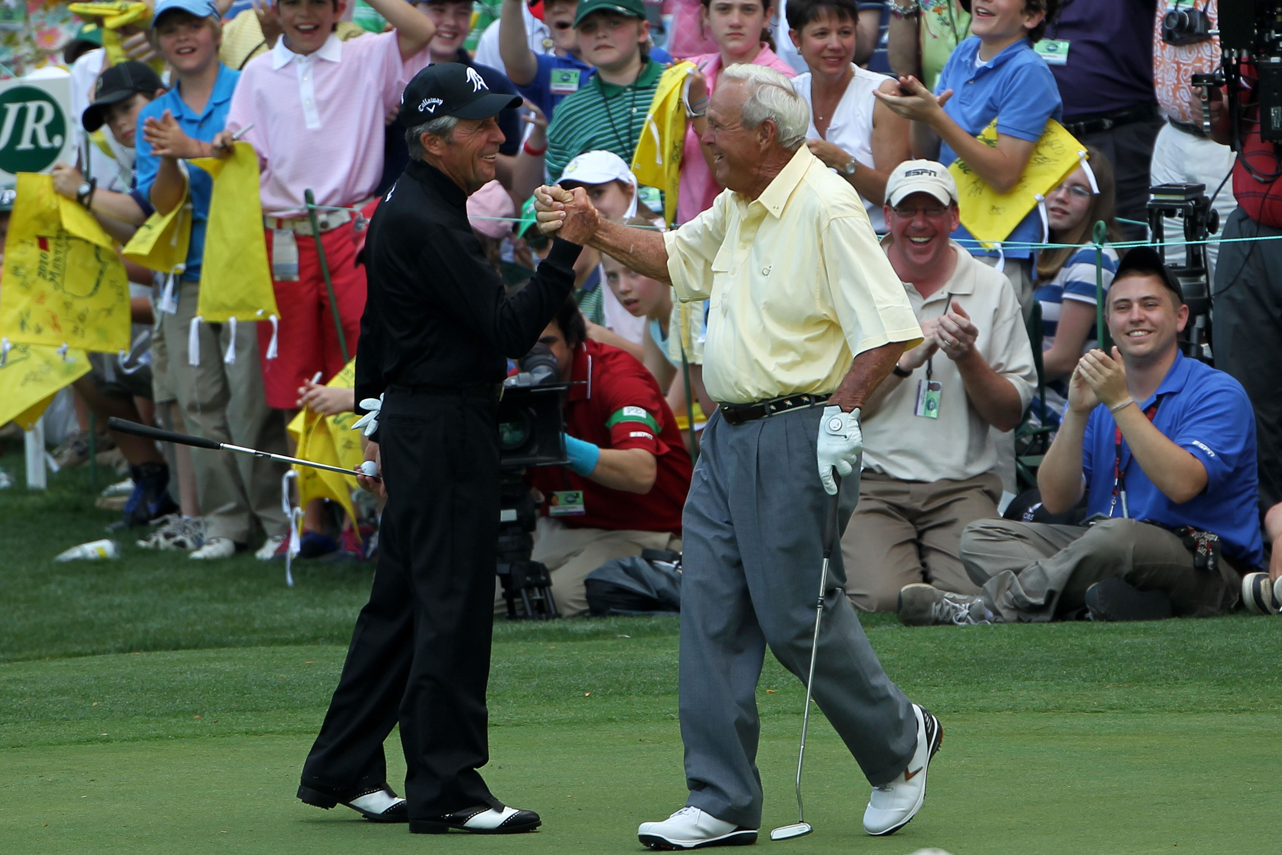AUGUSTA, GA - APRIL 07:  Gary Player (L) congratulates Arnold Palmer on sinking a long birdie putt during the Par 3 Contest prior to the 2010 Masters Tournament at Augusta National Golf Club on April 7, 2010 in Augusta, Georgia.  (Photo by Jamie Squire/Ge