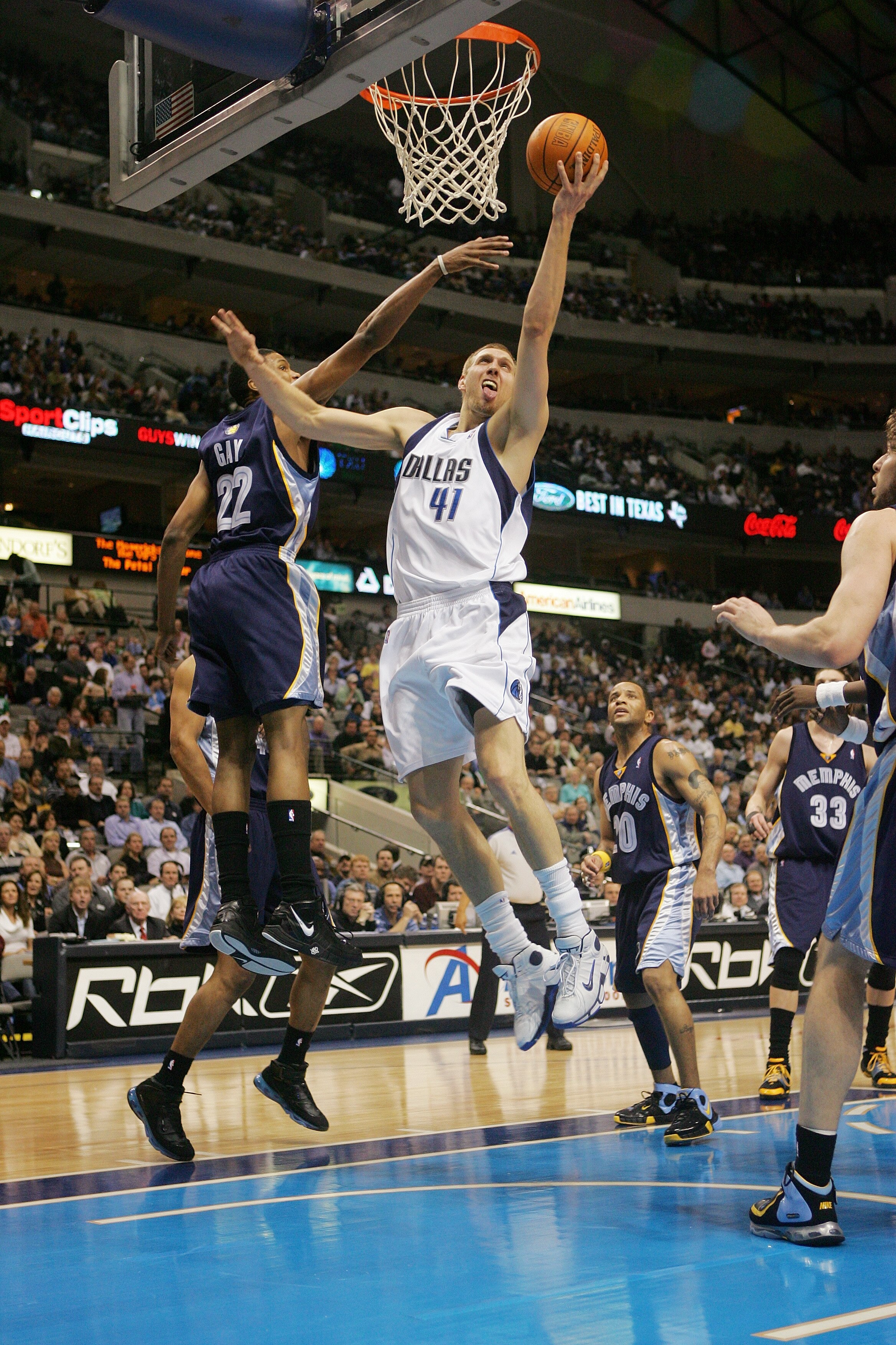 DALLAS - FEBRUARY 7:  Dirk Nowitzki #41 of the Dallas Mavericks goes to the basket against Rudy Gay #22 of the Memphis Grizzlies on February 7, 2007 at American Airlines Center in Dallas, Texas. The Mavs won 113-97.  NOTE TO USER: User expressly acknowled