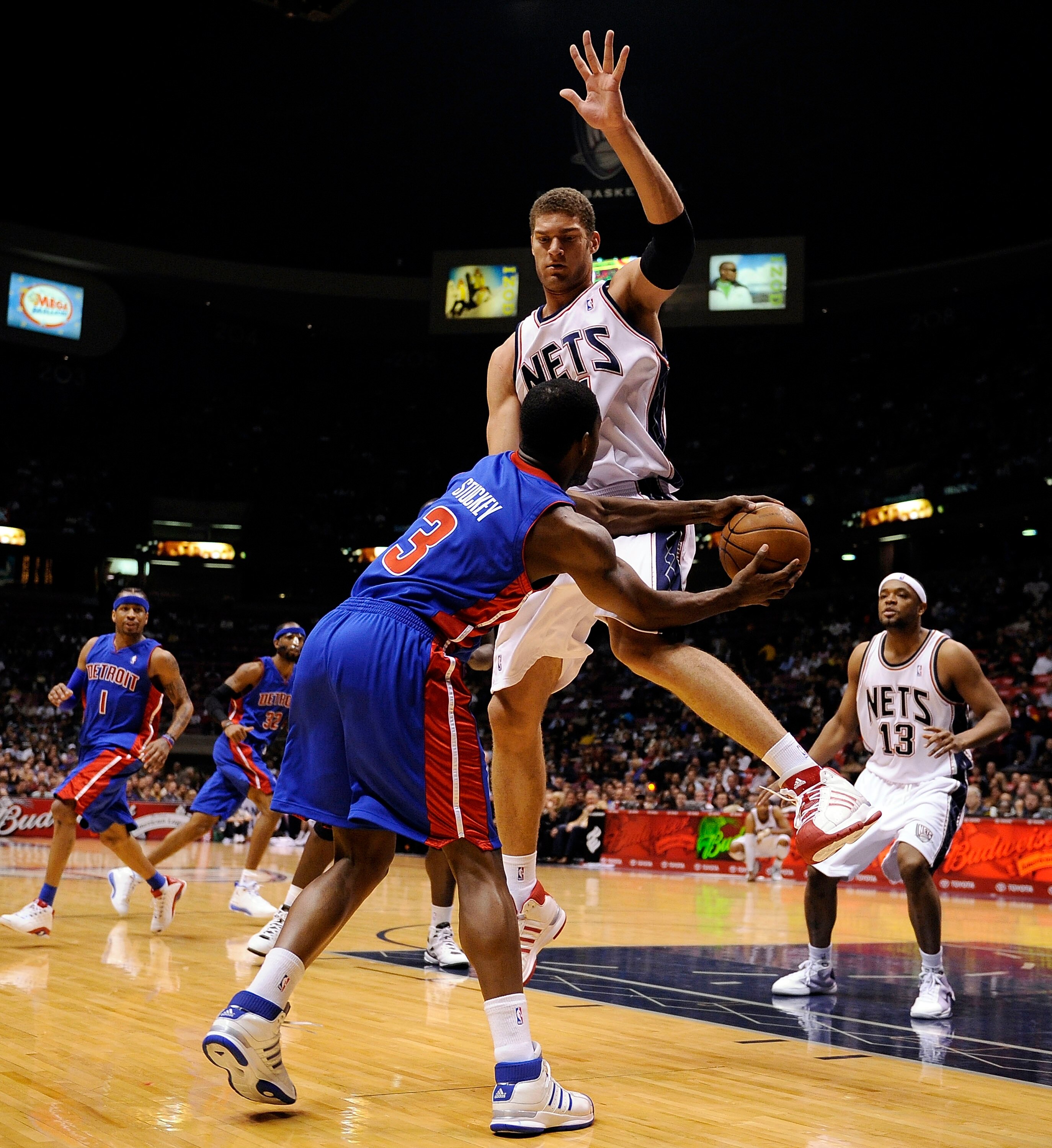 EAST RUTHERFORD, NJ - NOVEMBER 07:  Rodney Stuckey #3 of the Detroit Pistons tries to pass the ball around Brook Lopez #11 of the New Jersey Nets during their game November 7, 2008 at the Izod Arena in East Rutherford, New Jersey.  (Photo by Jeff Zelevans