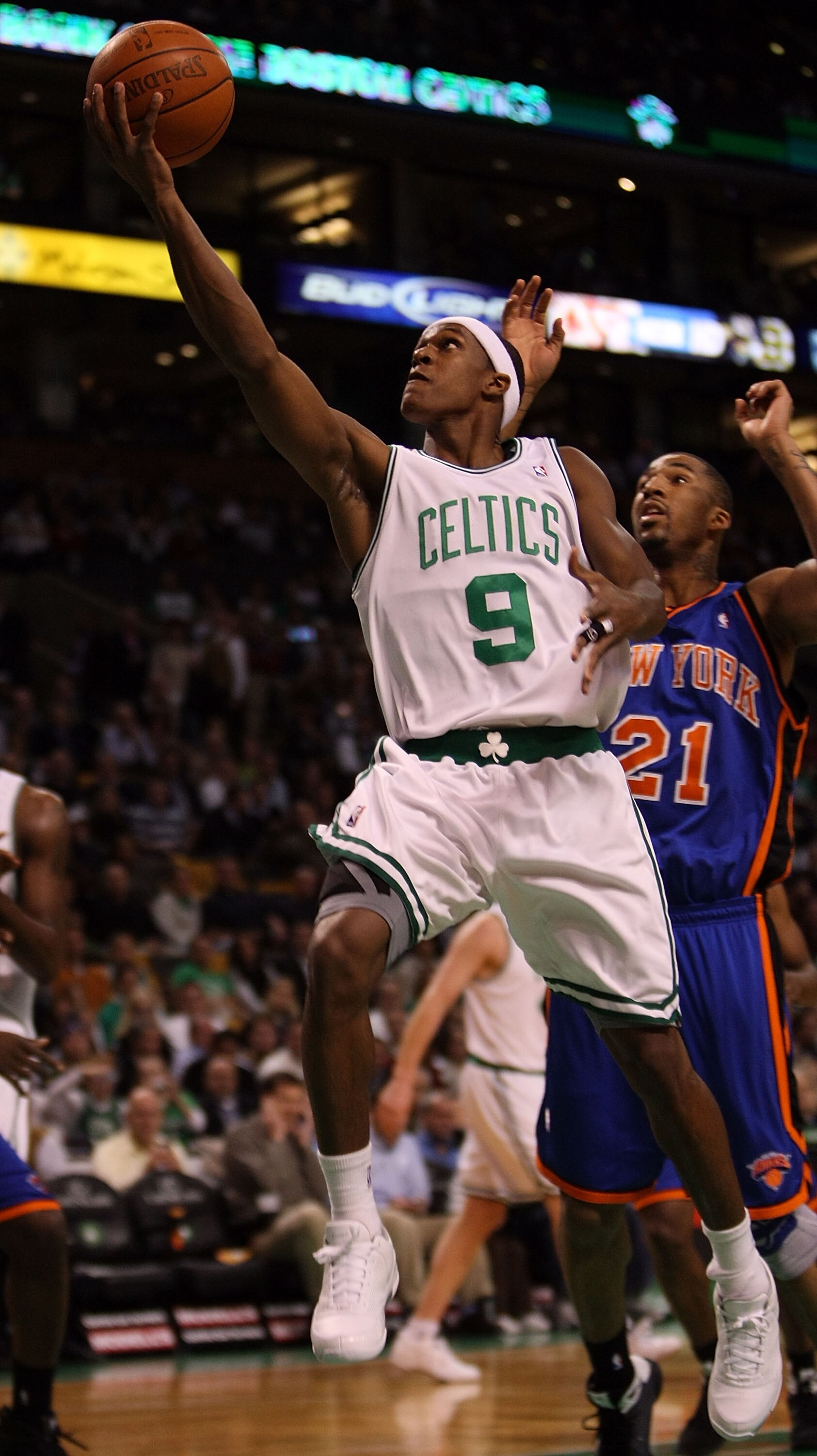 BOSTON - NOVEMBER 18:  Rajon Rondo #9 of the Boston Celtics drives for the net past Wilson Chandler #21 of the New York Knicks on November 18,  2008 at TD Banknorth Garden in Boston, Massachusetts. NOTE TO USER: User expressly acknowledges and agrees that