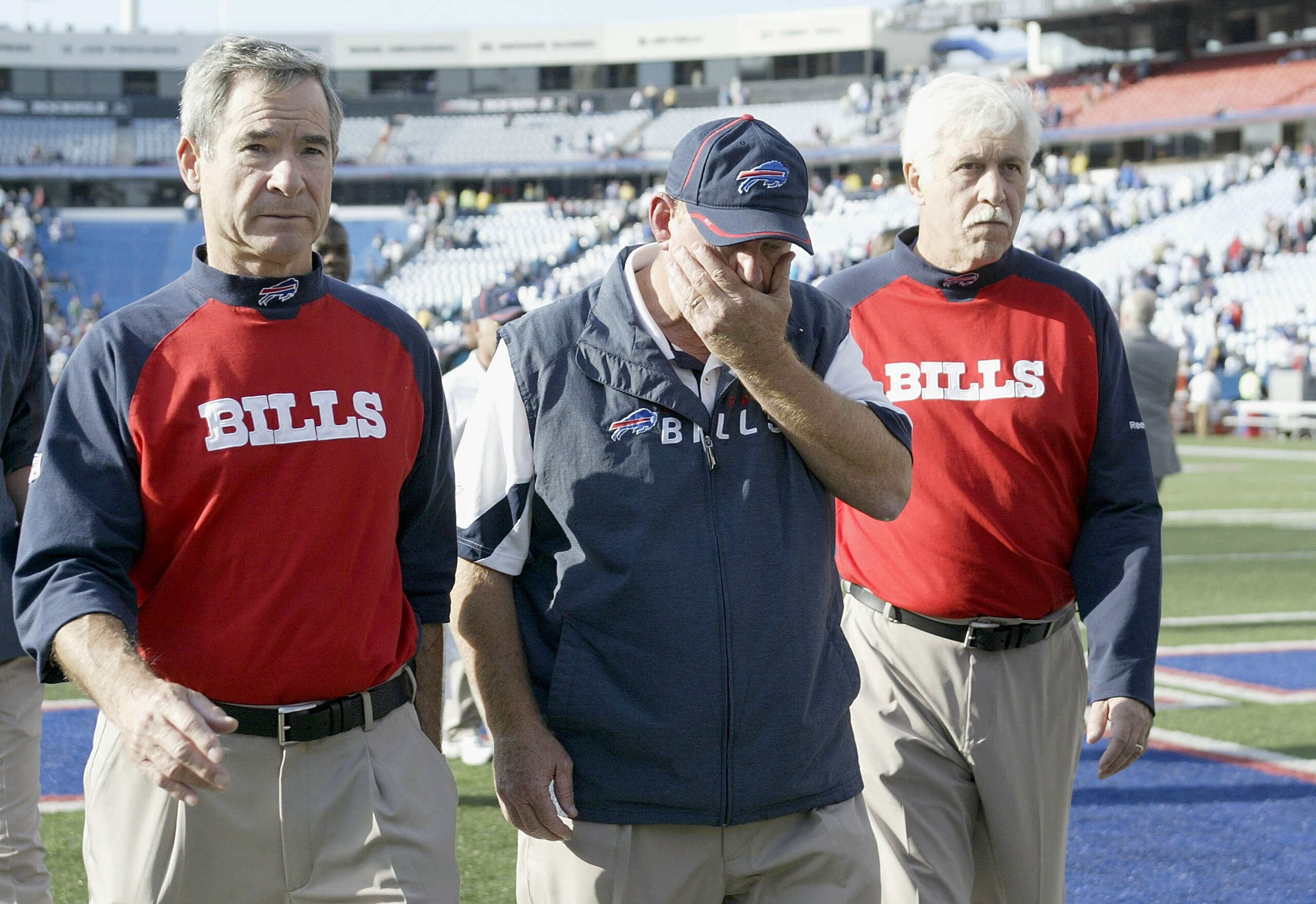 ORCHARD PARK, NY - OCTOBER 10: Head coach Chan Gailey (C) of the Buffalo Bills walks off the field between two Bills security personel after losing to the Jacksonville Jaguars at Ralph Wilson Stadium on October 10, 2010 in Orchard Park, New York. Jacksonv ORCHARD PARK, NY - OCTOBER 10: Head coach Chan Gailey (C) of the Buffalo Bills walks off the field between two Bills security personel after losing to the Jacksonville Jaguars at Ralph Wilson Stadium on October 10, 2010 in Orchard Park, New York. Jacksonv