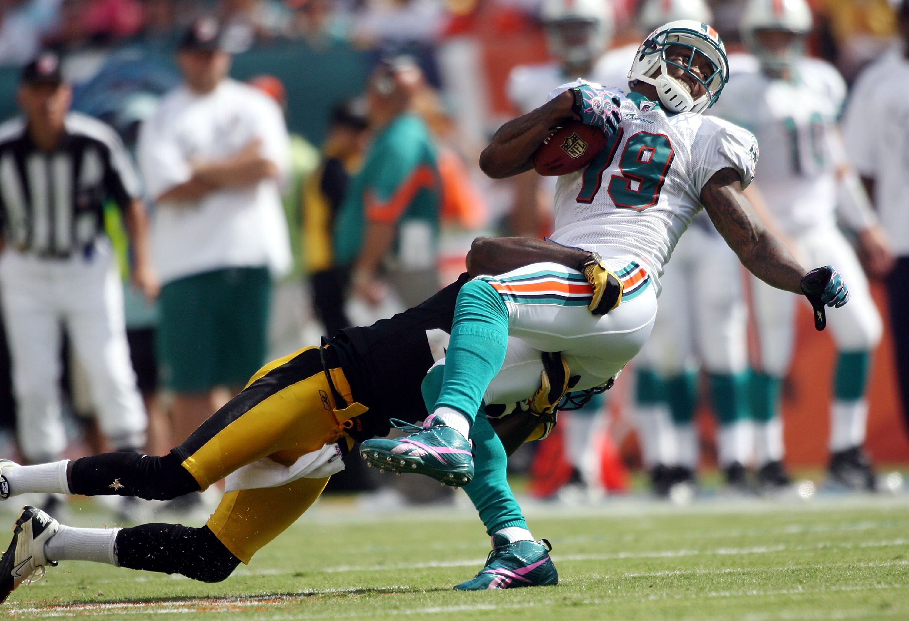 MIAMI - OCTOBER 24:  Receiver Brandon Marshall #19 is brought down by the Pittsburgh Steelers at Sun Life Stadium on October 24, 2010 in Miami, Florida.  (Photo by Marc Serota/Getty Images)