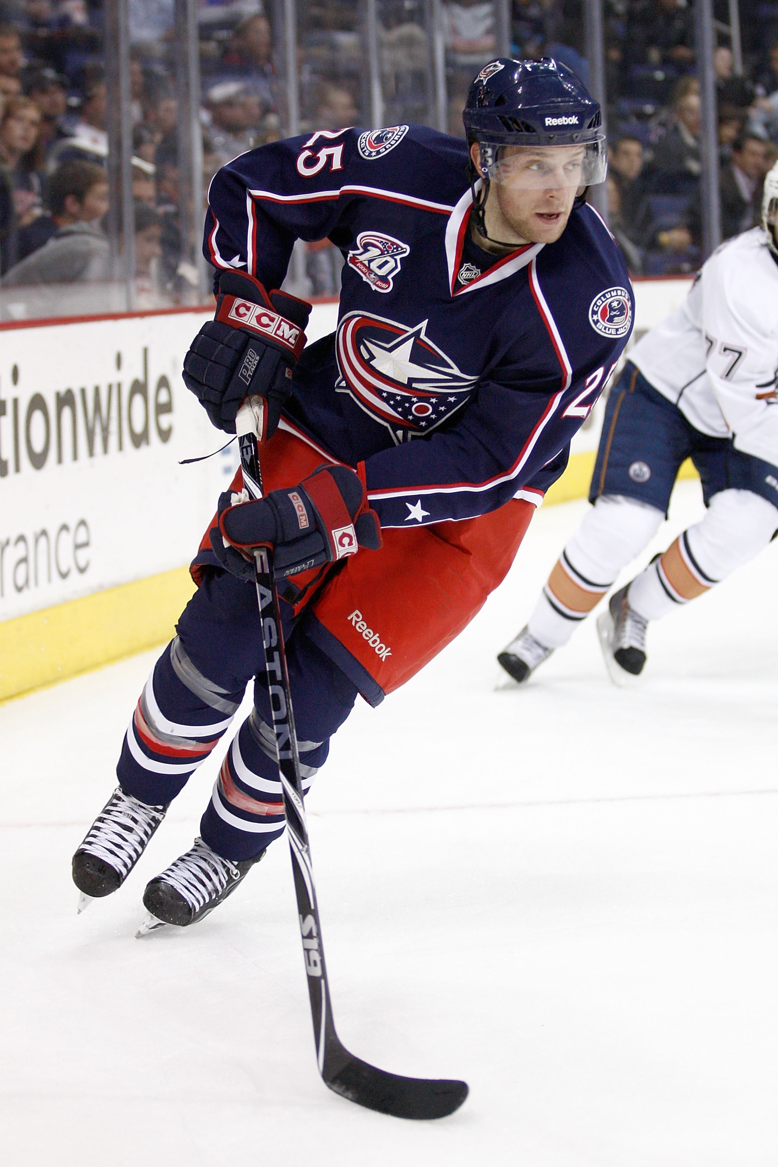 COLUMBUS,OH - OCTOBER 28:  Kyle Wilson #25 of the Columbus Blue Jackets skates the puck out from the corner during the second period against the Edmonton Oilers on October 28, 2010 at Nationwide Arena in Columbus, Ohio.  (Photo by John Grieshop/Getty Imag
