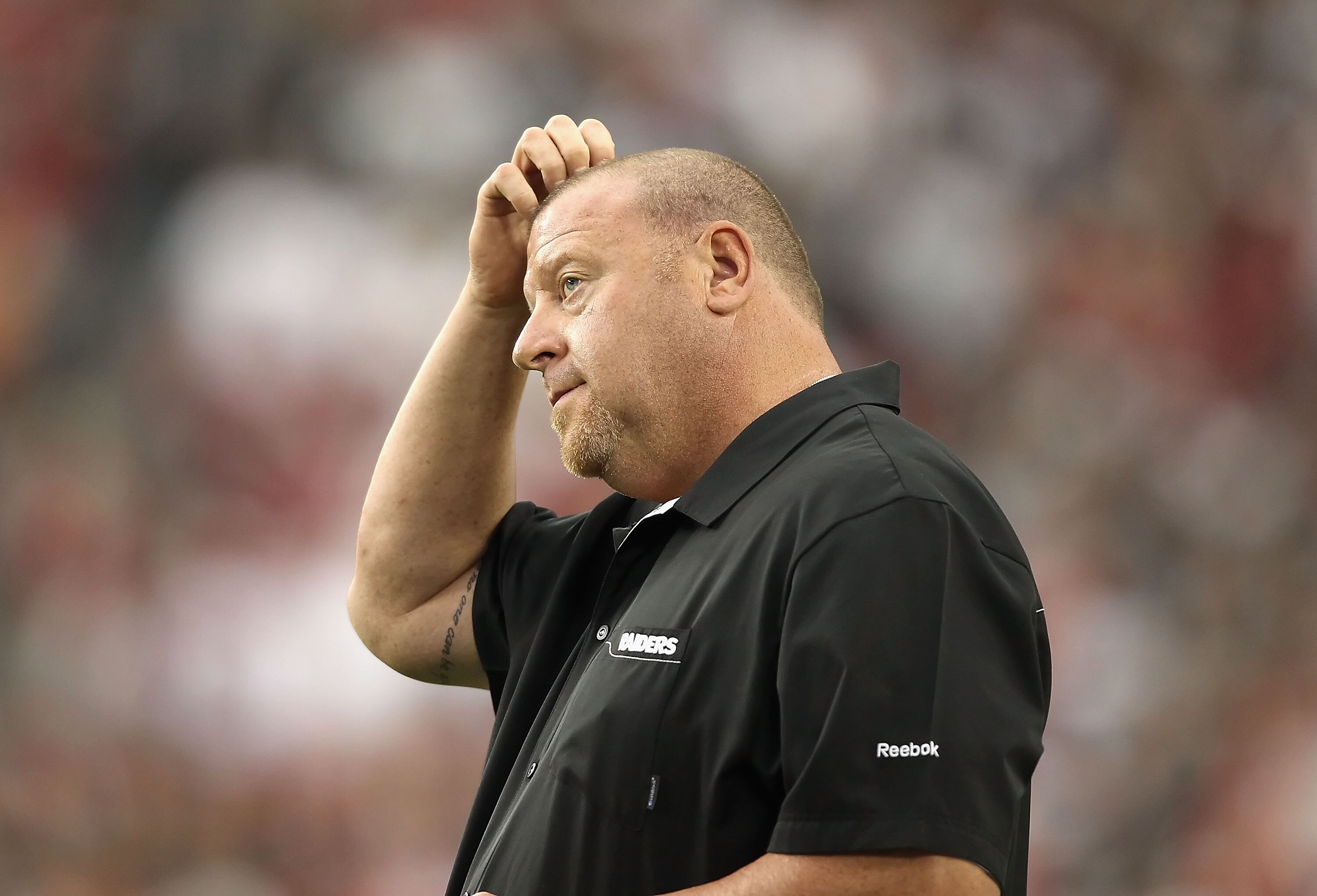 GLENDALE, AZ - SEPTEMBER 26:  Head coach Tom Cable of the Oakland Raiders stands on the sidelines during the NFL game against the Arizona Cardinals at the University of Phoenix Stadium on September 26, 2010 in Glendale, Arizona.  The Cardinals defeated th