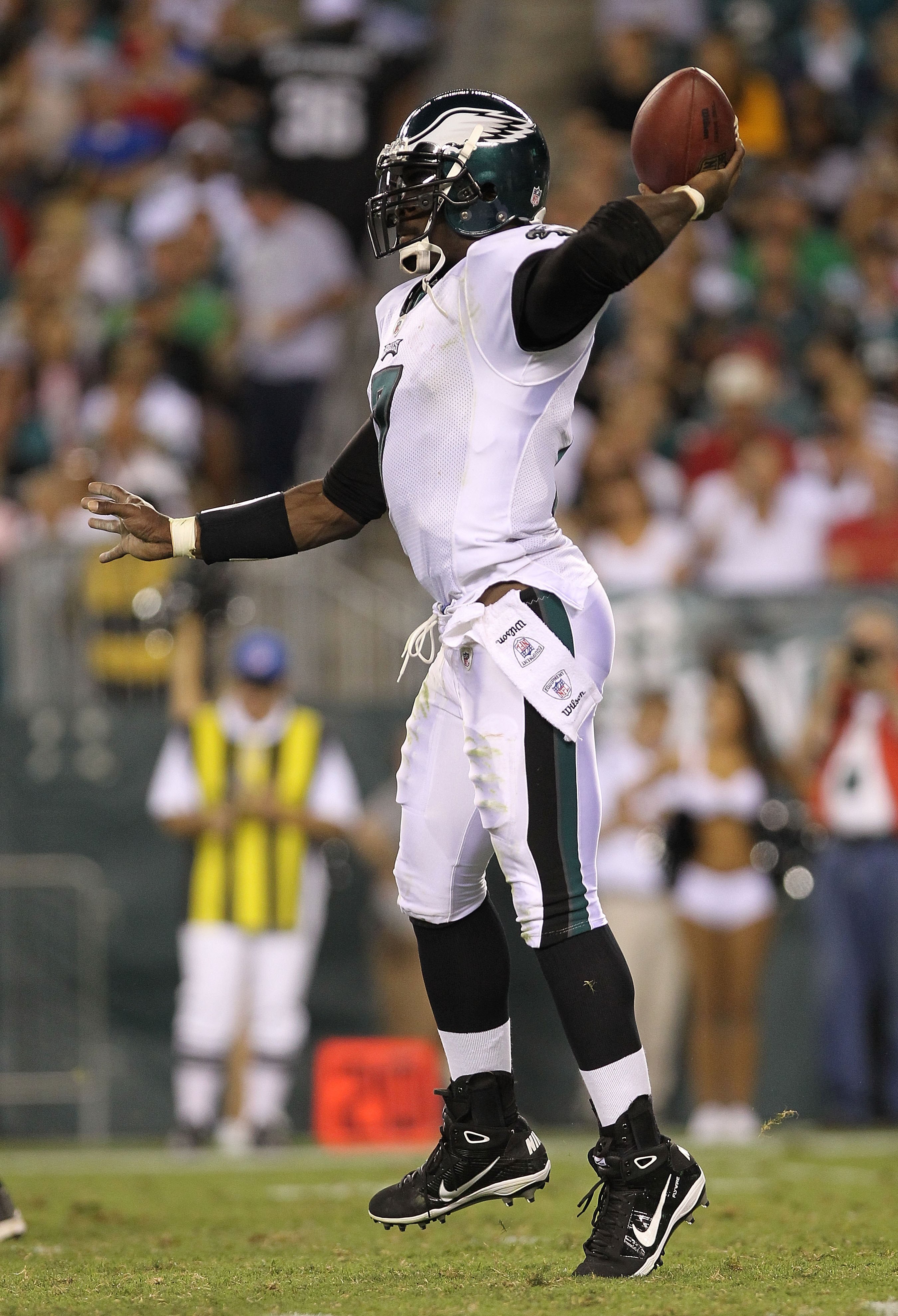PHILADELPHIA - AUGUST 13:  Michael Vick #7 of the Philadelphia Eagles rolls out to pass against the Jacksonville Jaguars during their preseason game at Lincoln Financial Field on August 13, 2010 in Philadelphia, Pennsylvania.  (Photo by Nick Laham/Getty I