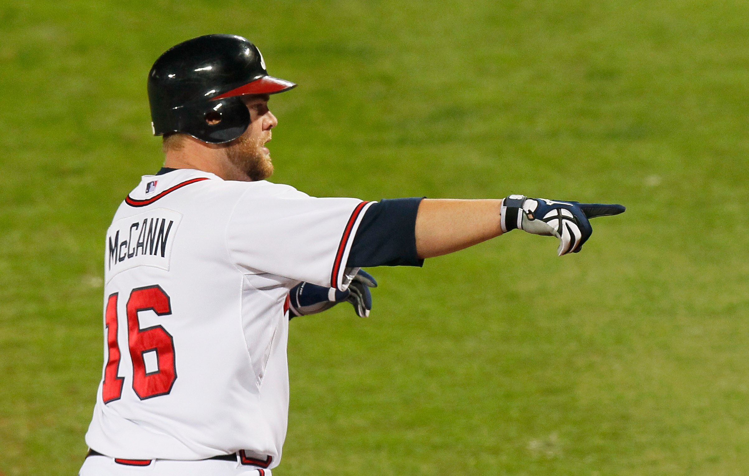 ATLANTA - OCTOBER 11:  Brian McCann #16 of the Atlanta Braves hits solo homer in the sixth inning against the San Francisco Giants during Game Four of the NLDS of the 2010 MLB Playoffs at Turner Field on October 11, 2010 in Atlanta, Georgia.  (Photo by Ke
