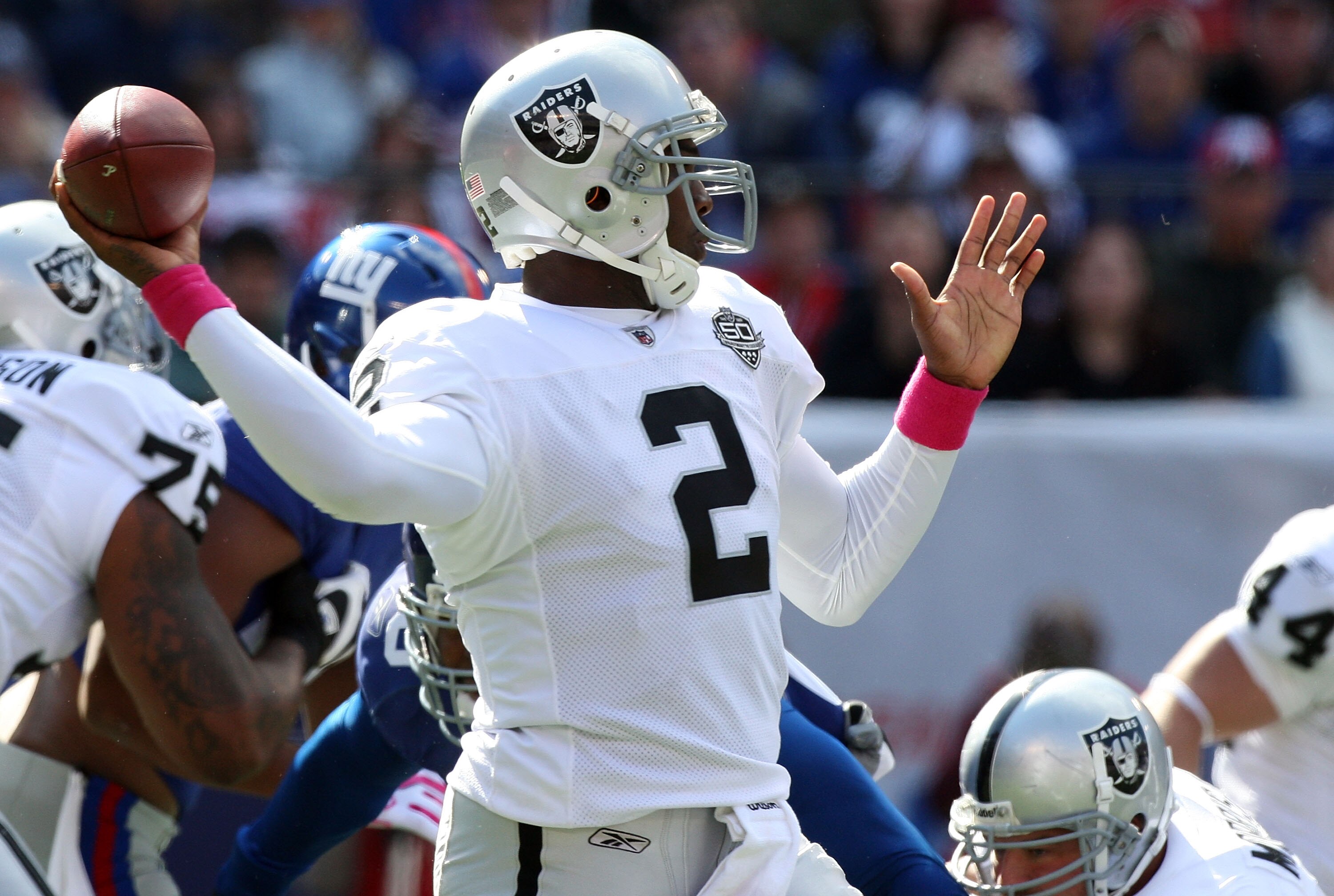 EAST RUTHERFORD, NJ - OCTOBER 11:  JaMarcus Russell #2 of the Oakland Raiders throws a pass against the New York Giants on October 11, 2009 at Giants Stadium in East Rutherford, New Jersey.  (Photo by Jim McIsaac/Getty Images)