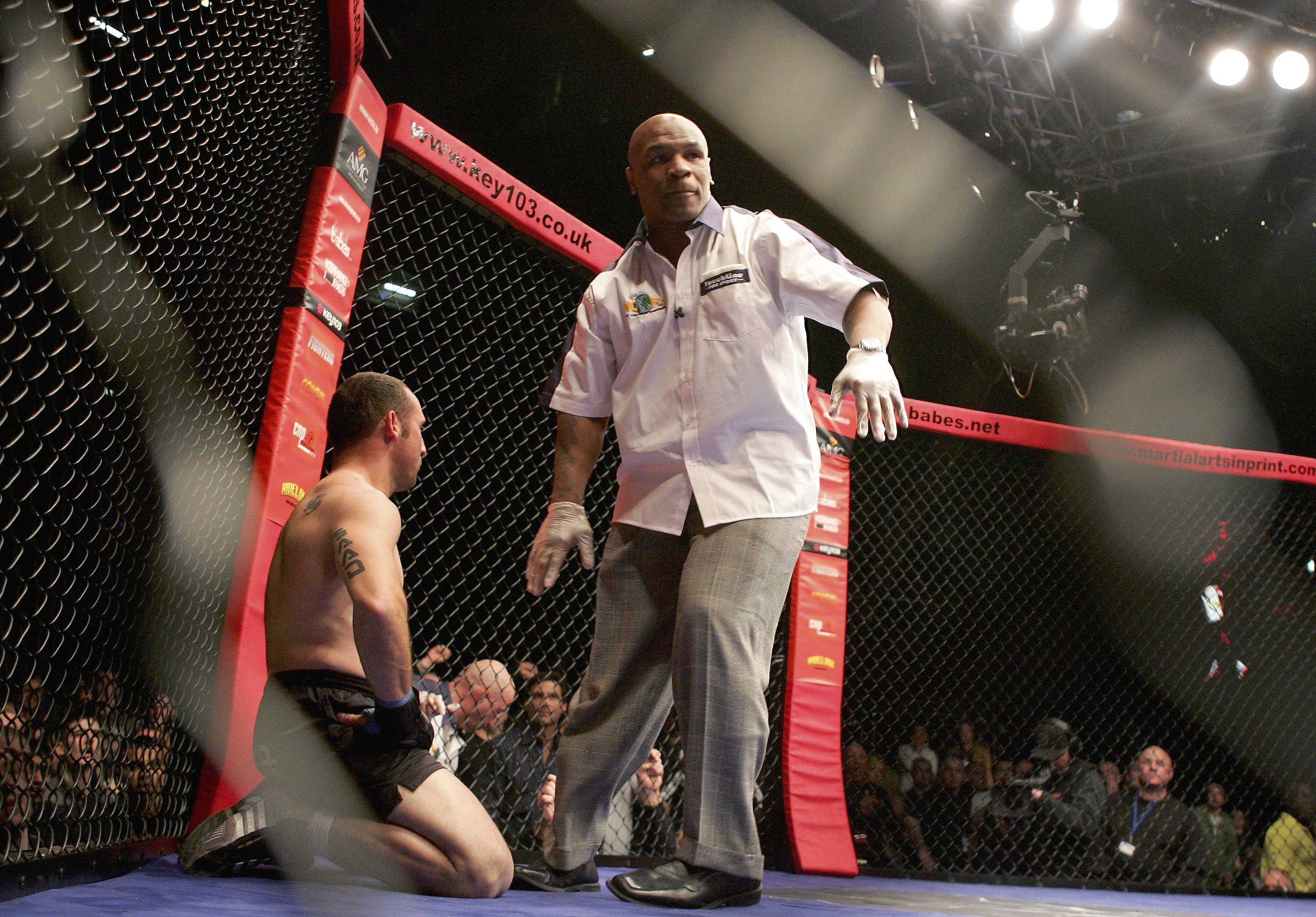 MANCHESTER, UNITED KINGDOM - MARCH 18:  Referee Mike Tyson stops the fight between Diego Gonzalez (L) of Spain and Terry Etim of England, declard the winner, during the World Cage Fighting Championships at the MEN Arena on March 18, 2006 in Manchester, En