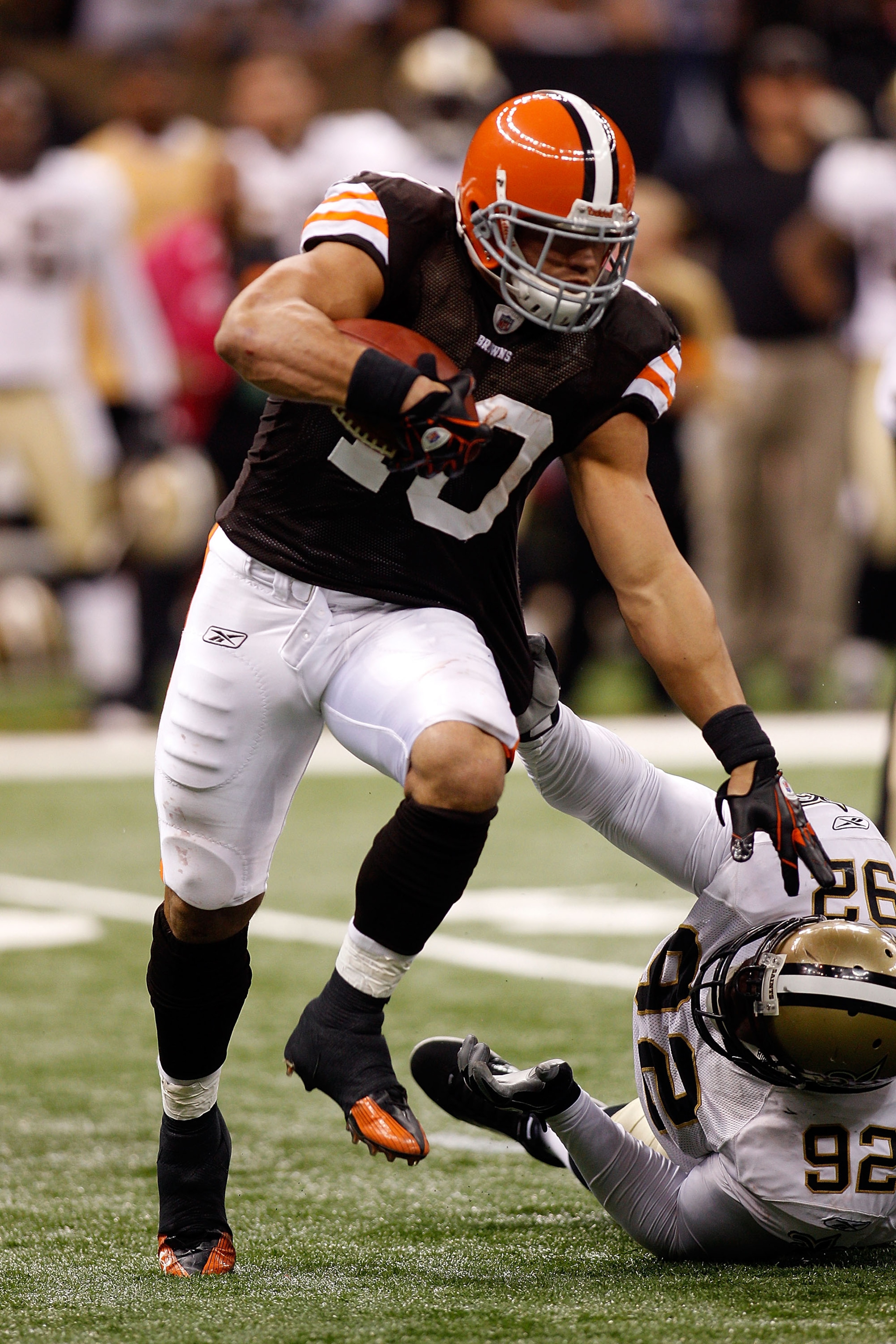 NEW ORLEANS - OCTOBER 24: Peyton Hillis #40 of the Cleveland Browns avoids a tackle by Remi Ayodele #92 of the New Orleans Saints at the Louisiana Superdome on October 24, 2010 in New Orleans, Louisiana. The Browns defeated the Saints 30-17. (Photo by NEW ORLEANS - OCTOBER 24: Peyton Hillis #40 of the Cleveland Browns avoids a tackle by Remi Ayodele #92 of the New Orleans Saints at the Louisiana Superdome on October 24, 2010 in New Orleans, Louisiana. The Browns defeated the Saints 30-17. (Photo by