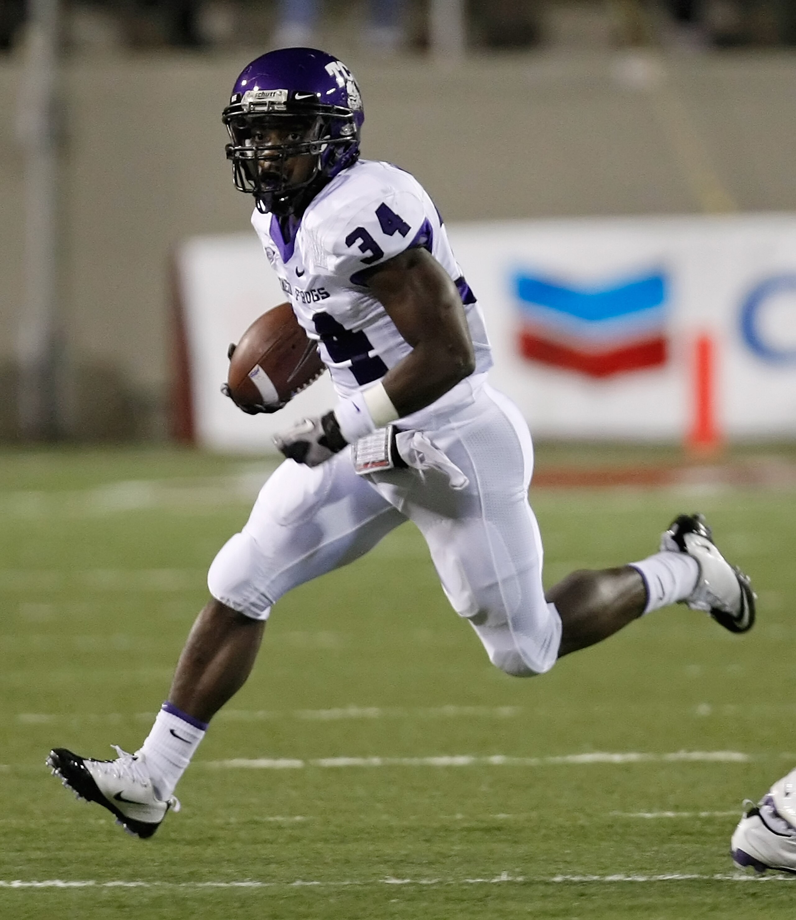 LAS VEGAS - OCTOBER 30:  Ed Wesley #34 of the Texas Christian University Horned Frogs runs for yardage against the UNLV Rebels during their game at Sam Boyd Stadium October 30, 2010 in Las Vegas, Nevada. TCU won 48-6.  (Photo by Ethan Miller/Getty Images)