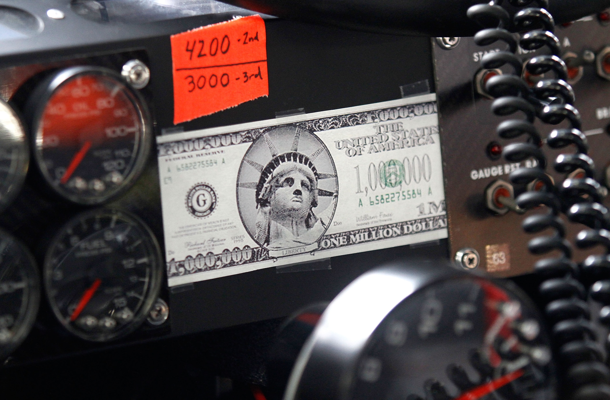 CONCORD, NC - MAY 21:  A general view of a fake million dollar bill that was taped to the dash of the #00 Aaron's Dream Machine Toyota, driven by David Reutimann (not pictured), during practice for the NASCAR Sprint Cup Series All-Star Race at Charlotte M