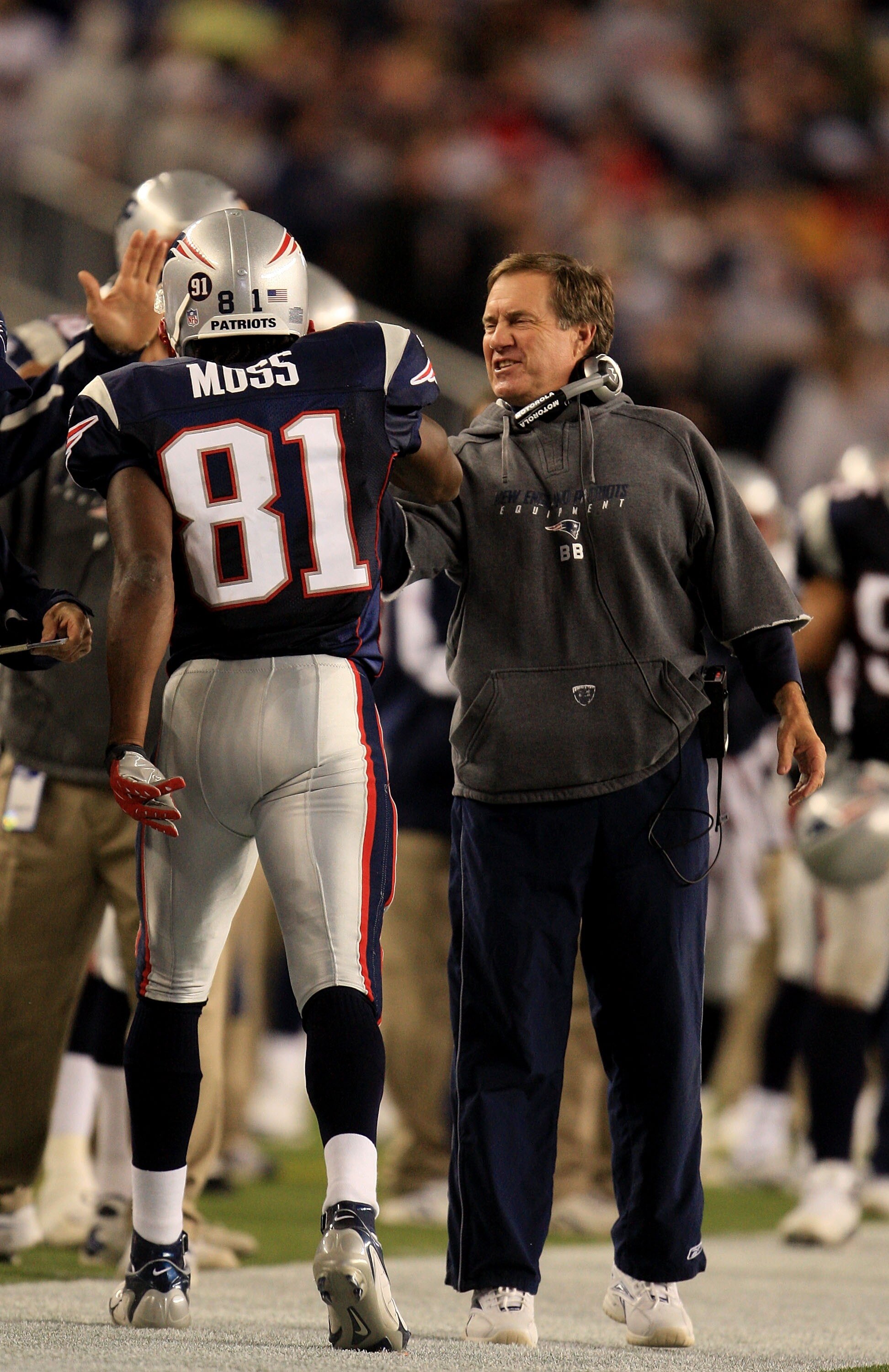 FOXBORO, MA - SEPTEMBER 16:  Head coach Bill Belichick of the New England Patriots smiles after Randy Moss's touchdown in the fourth quarter of their game against the San Diego Chargers at Gillette Stadium on September 16, 2007 in Foxboro, Massachusetts.