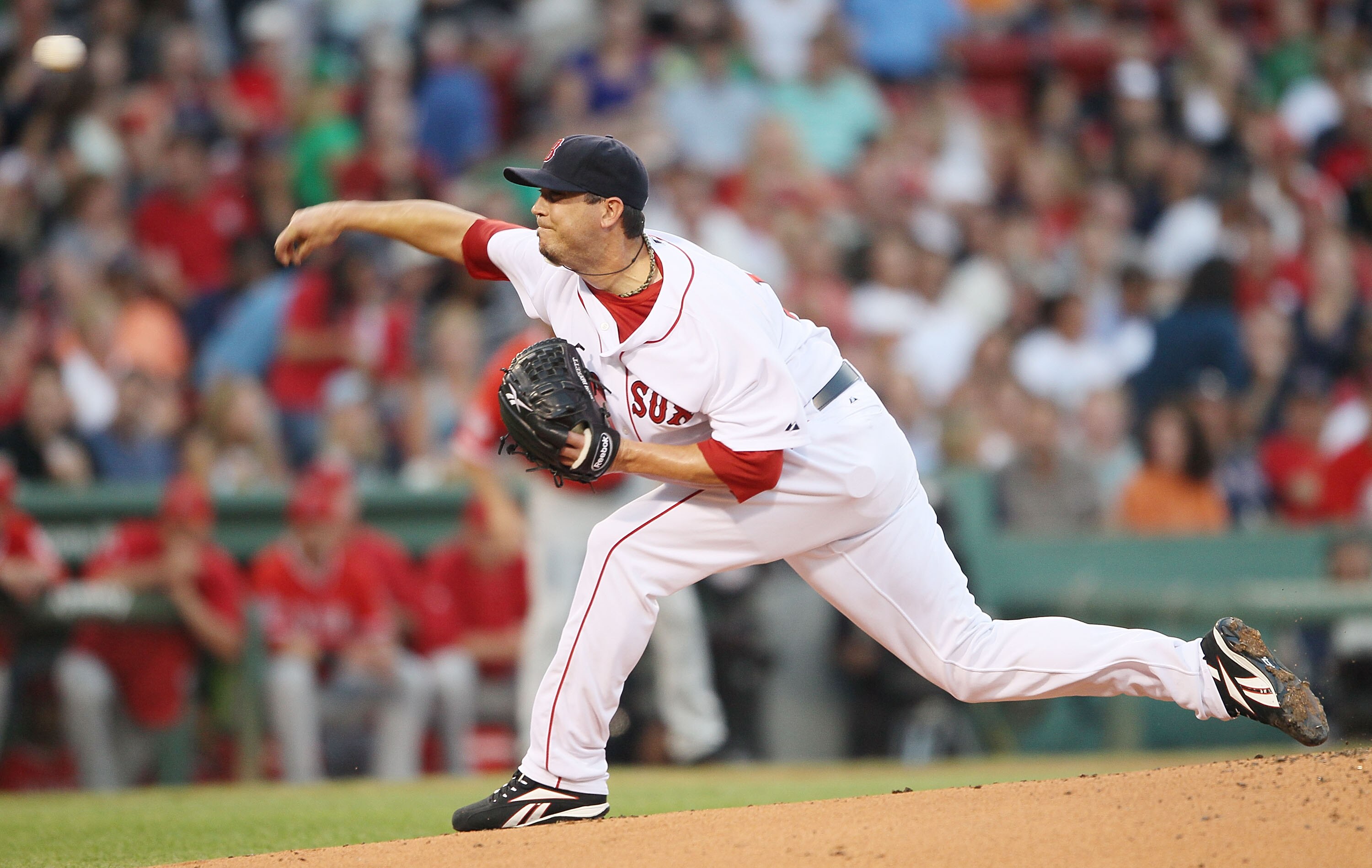 BOSTON - AUGUST 19:  Josch Beckett #19 of the Boston Red Sox delivers a pitch in the first inning against the Los Angeles Angels of Anaheim on August 19, 2010 at Fenway Park in Boston, Massachusetts.  (Photo by Elsa/Getty Images)