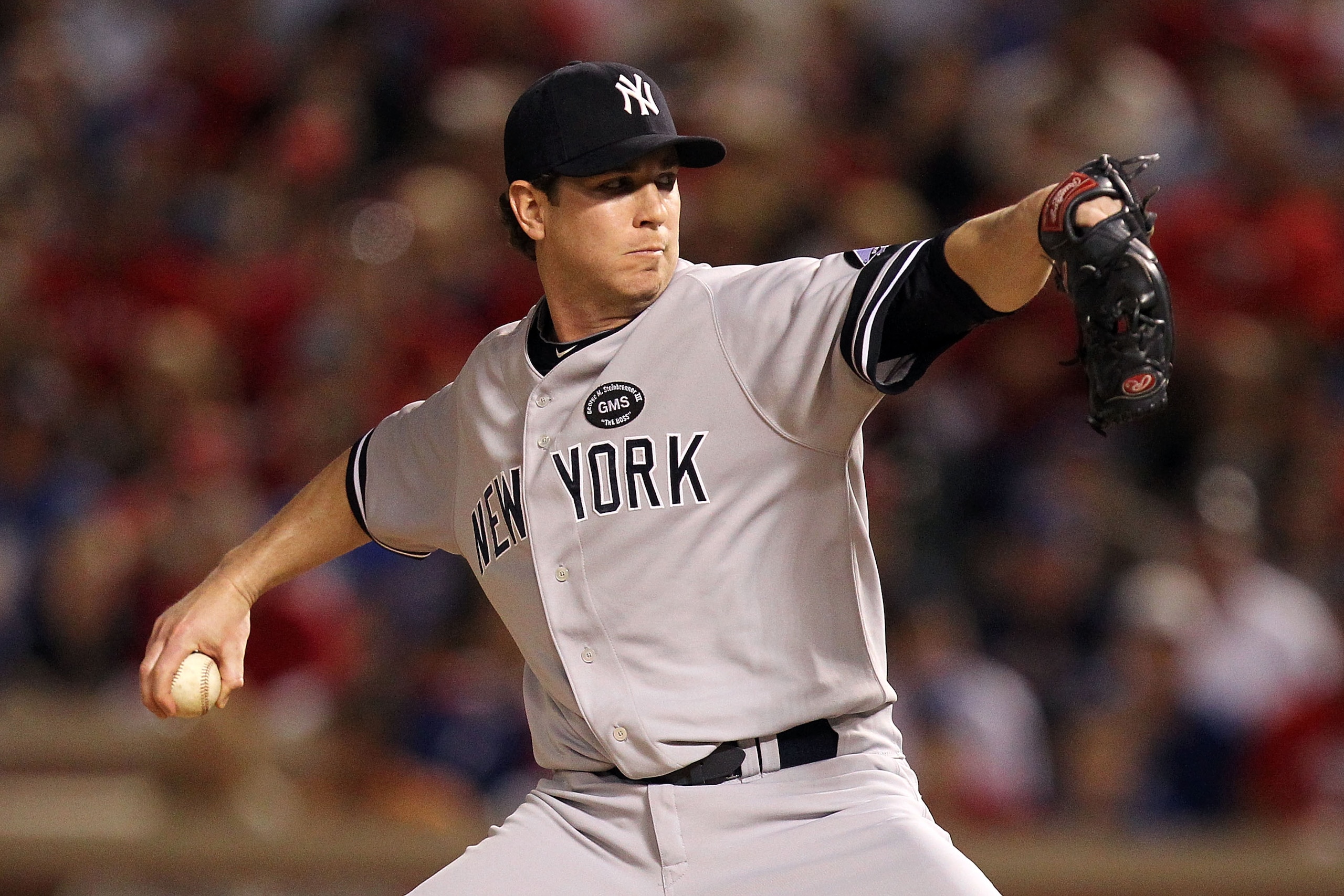 ARLINGTON, TX - OCTOBER 15:  Dustin Moseley #40 of the New York Yankees throws a pitch against the Texas Rangers in Game One of the ALCS during the 2010 MLB Playoffs at Rangers Ballpark in Arlington on October 15, 2010 in Arlington, Texas.  (Photo by Rona