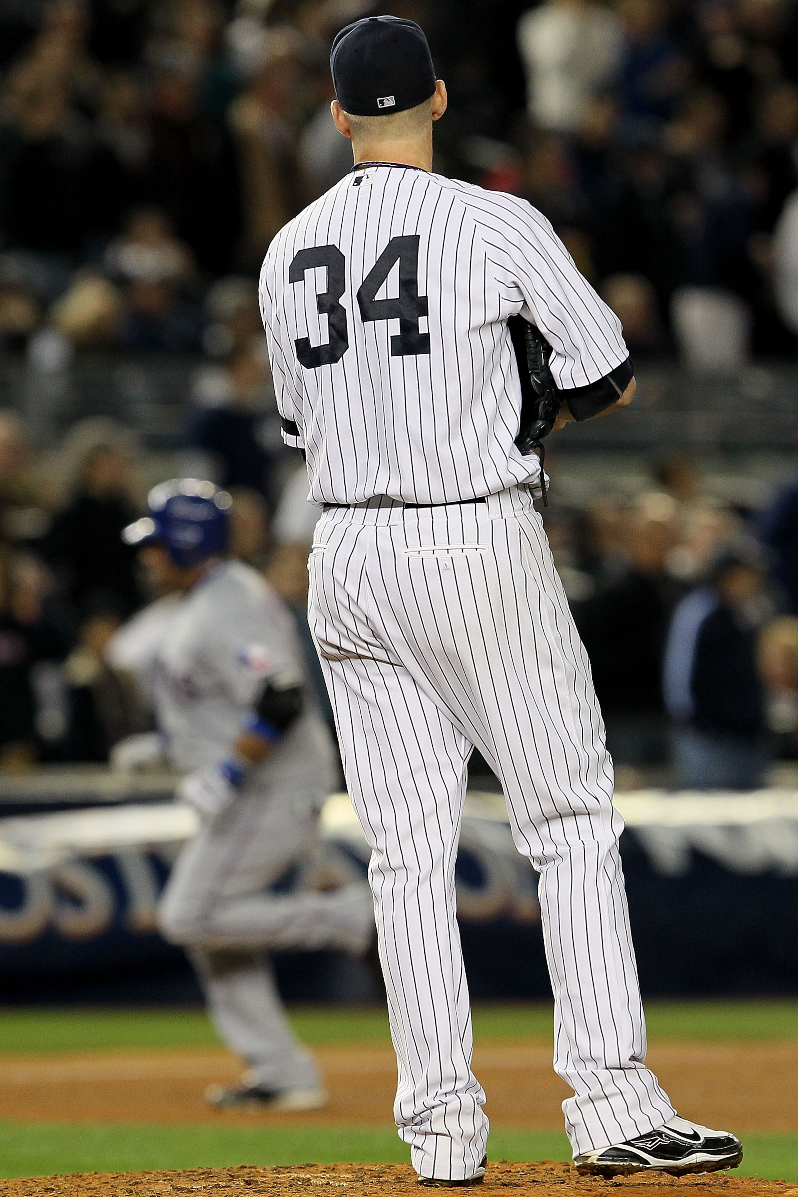 NEW YORK - OCTOBER 19:  Bengie Molina #11 of the Texas Rangers rounds the bases after hitting a three-run home run in the top of the sixth inning against A.J. Burnett #34 of the New York Yankees  in Game Four of the ALCS during the 2010 MLB Playoffs at Ya