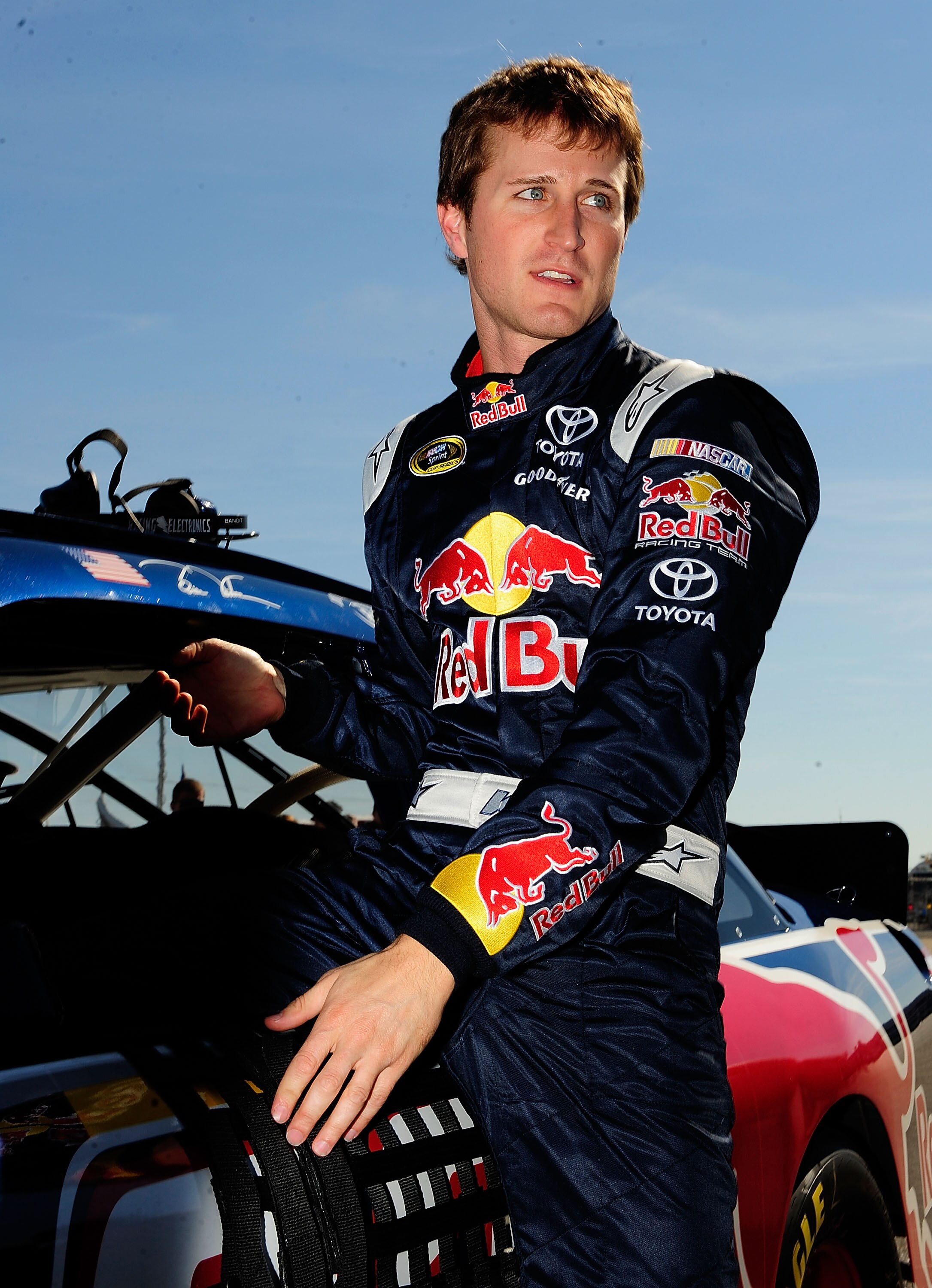 TALLADEGA, AL - OCTOBER 30:  Kasey Kahne, driver of the #83 Red Bull Toyota, climbs out of his car after qualifying for the NASCAR Sprint Cup Series AMP Energy Juice 500 at Talladega Superspeedway on October 30, 2010 in Talladega, Alabama.  (Photo by Rust