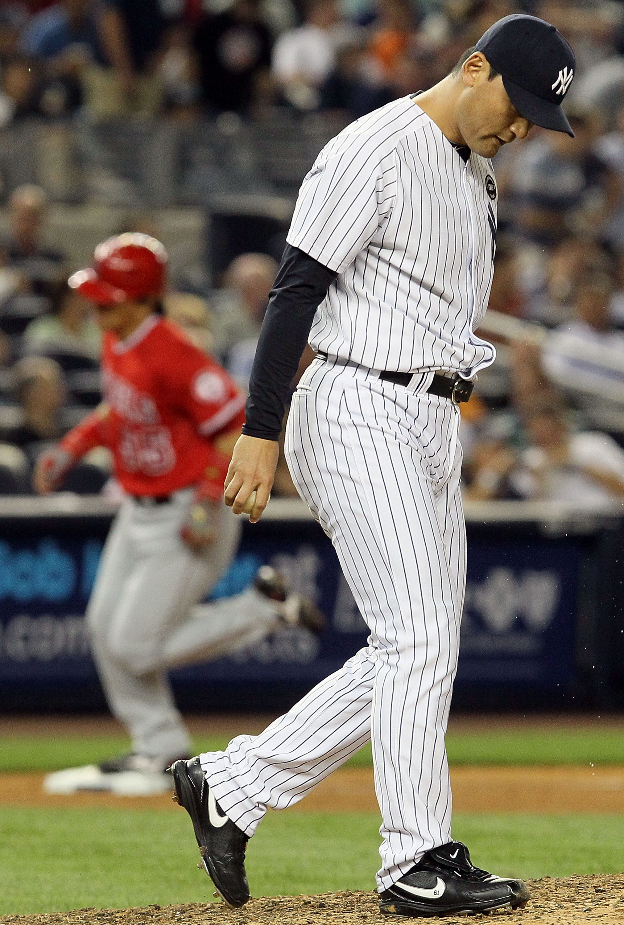 NEW YORK - JULY 20:  Chan Ho-Park #61 of the New York Yankees looks on after surrendering a two run seventh inning home run to Hideki Matsui #55 of the Los Angeles Angels of Anaheim on July 20, 2010 at Yankee Stadium in the Bronx borough of New York City.